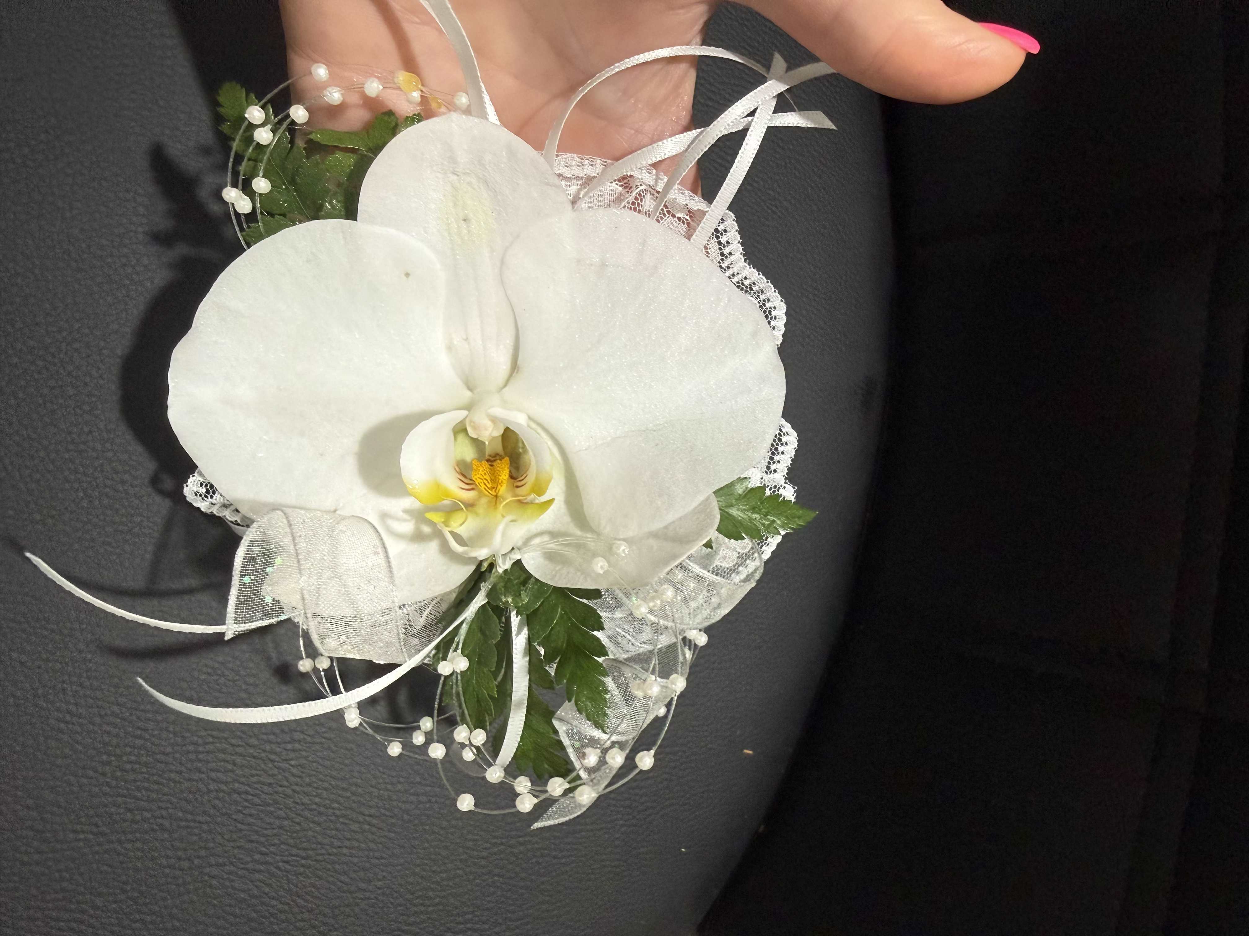 Pearl Luxe - White orchids paired with pearl or rhinestone accents for a refined, upscale look. Ideal for bridal or black-tie occasions.