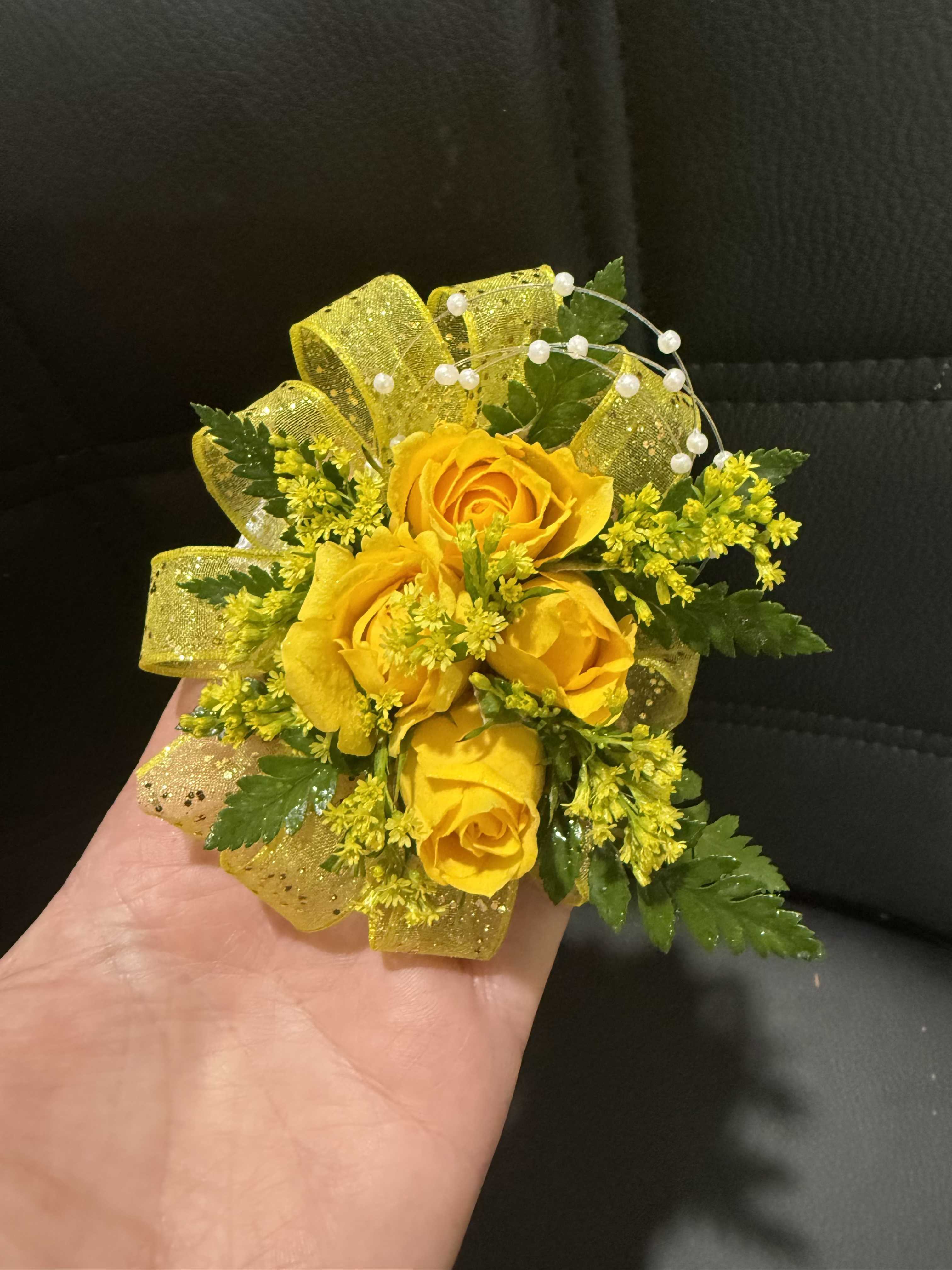 Sunny Delight - Soft yellow spray roses accented with gold ribbon or bands for a warm, elegant look