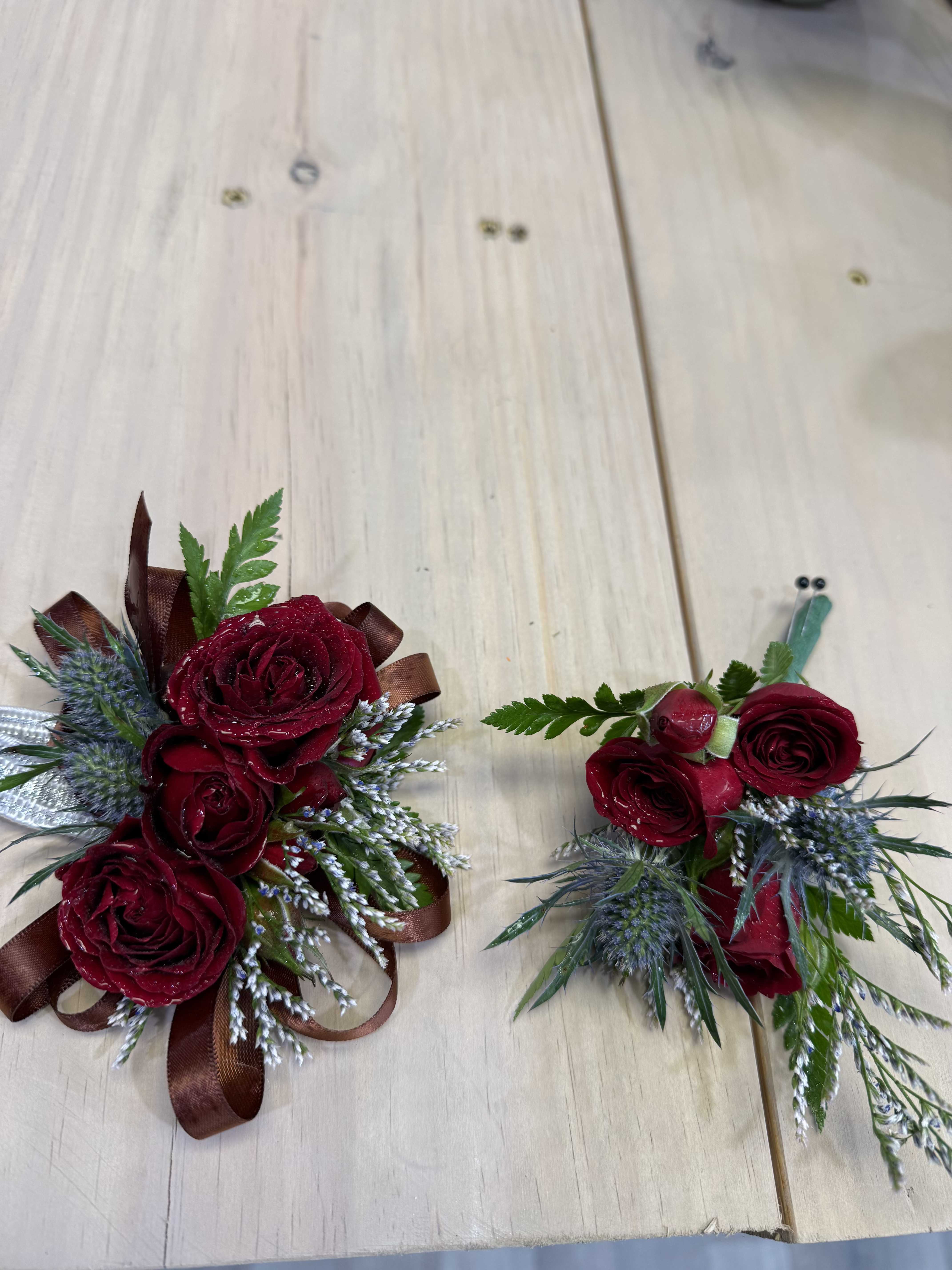 Rustic Love Set - Deep red roses with darker greenery and ribbon accents for a bold, romantic feel. Ideal for evening or formal occasions.