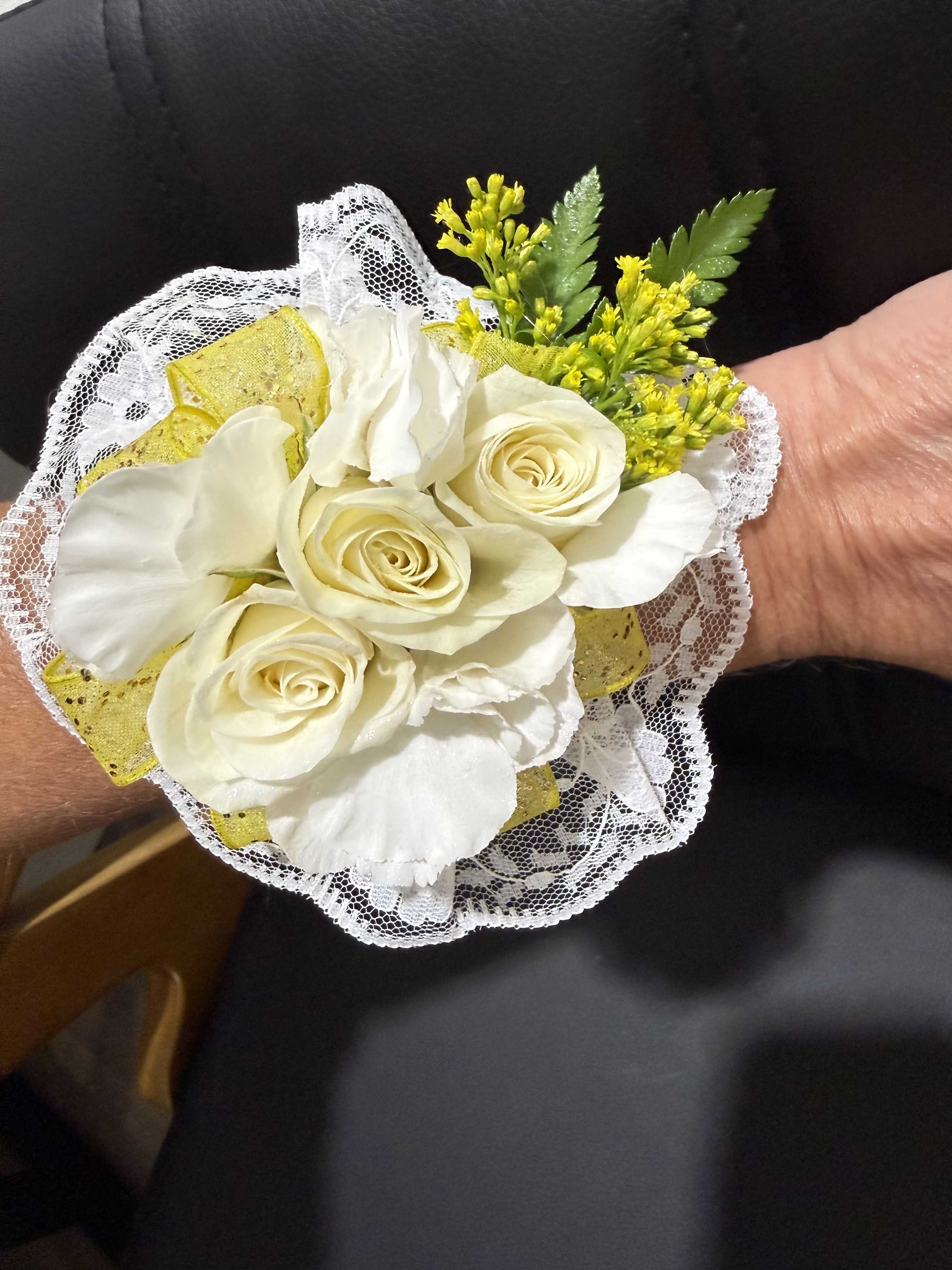 Sunlit Wings - A loose, garden-style corsage with white and yellow florals, airy greenery, and a butterfly accent. Fresh, natural, and slightly whimsical