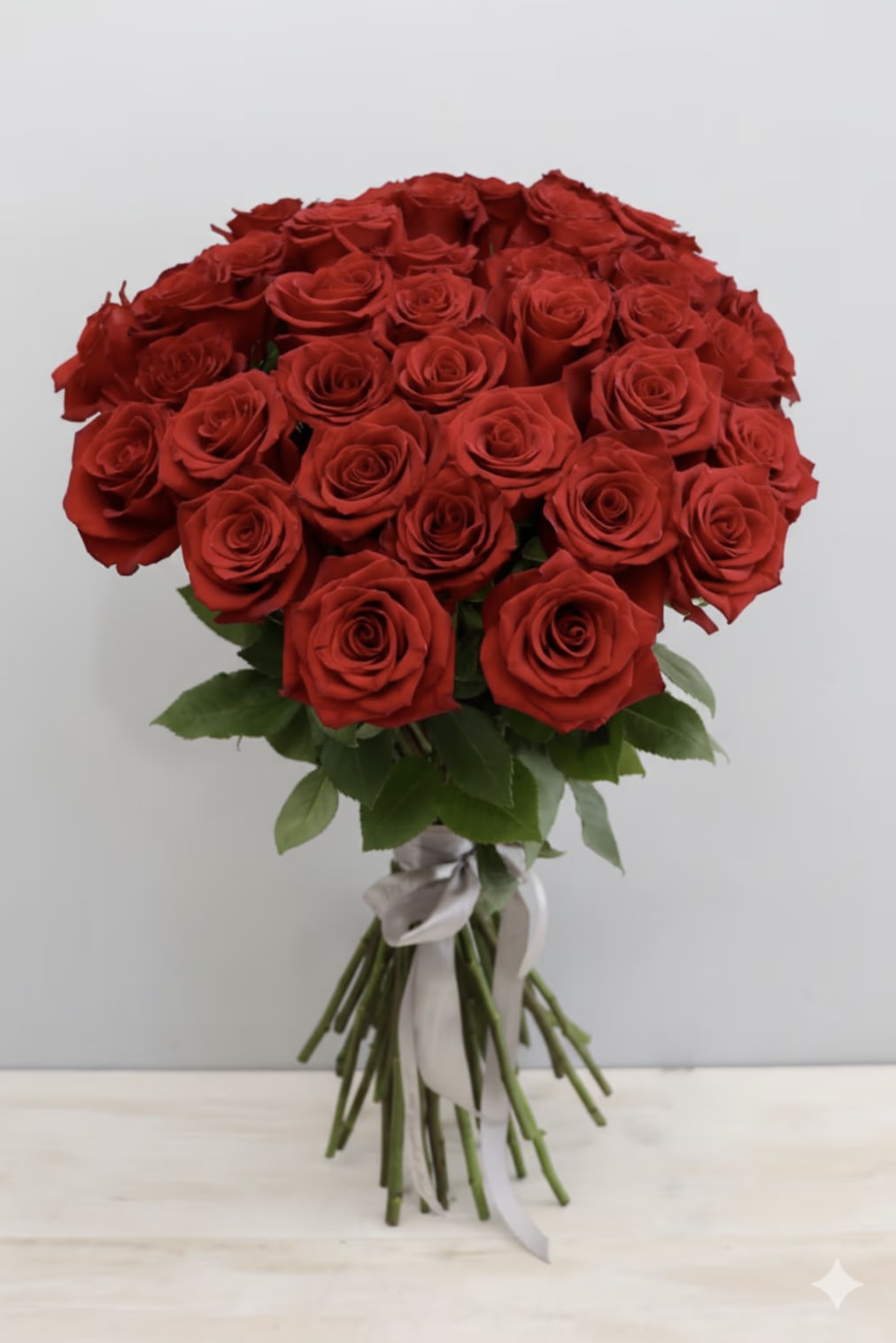 Ruby Red Roses - WeHo  - Roses, roses, roses!!! This bouquet features our tall premium red roses in all their glory.  The standard size has 25 roses, 50 for deluxe, and 75 for premium. This grand bouquet does not come wrapped - please specify if you would like wrapping in florist instruction box at checkout. Different colors available upon request and availability.