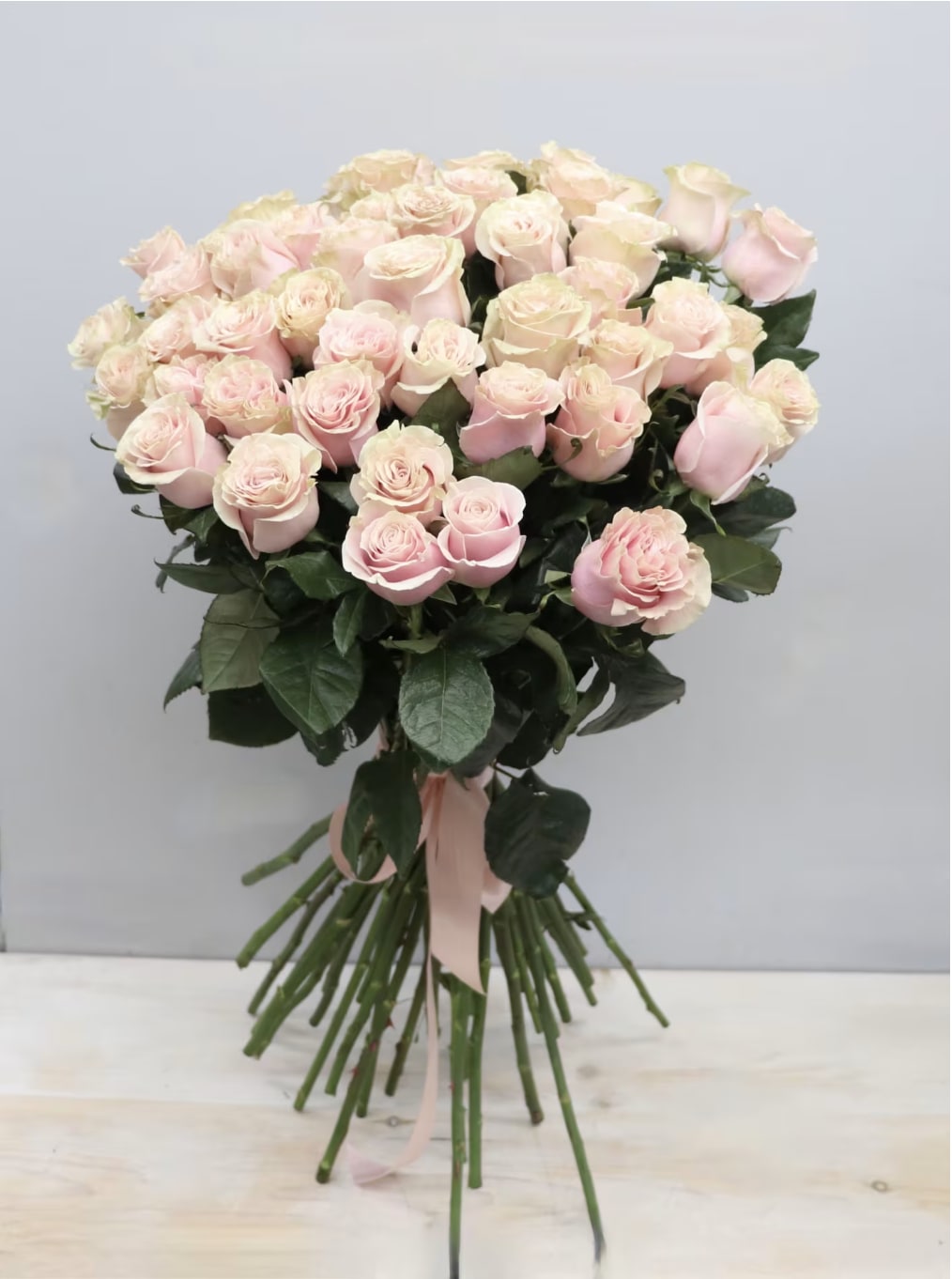 Light Pink Rose Special - WeHo  - Roses, roses, roses!!! This bouquet features our tall premium light pink roses in all their glory.  The standard size has 25 roses, 50 for deluxe, and 75 for premium. This grand bouquet does not come wrapped - please specify if you would like wrapping!