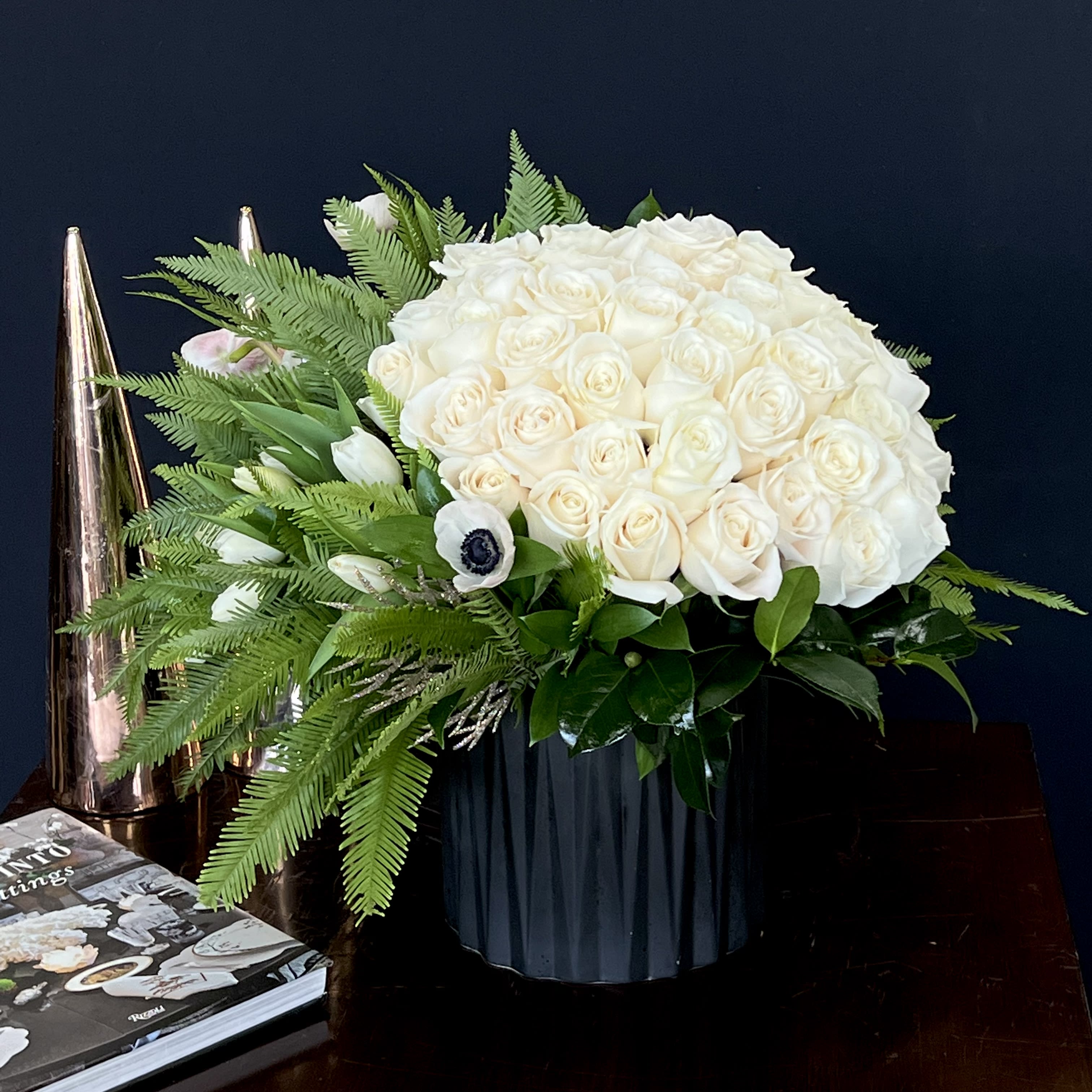 Daslyn  - A beautiful bouquet of white Roses, with Tulips and Ferns in a black container 