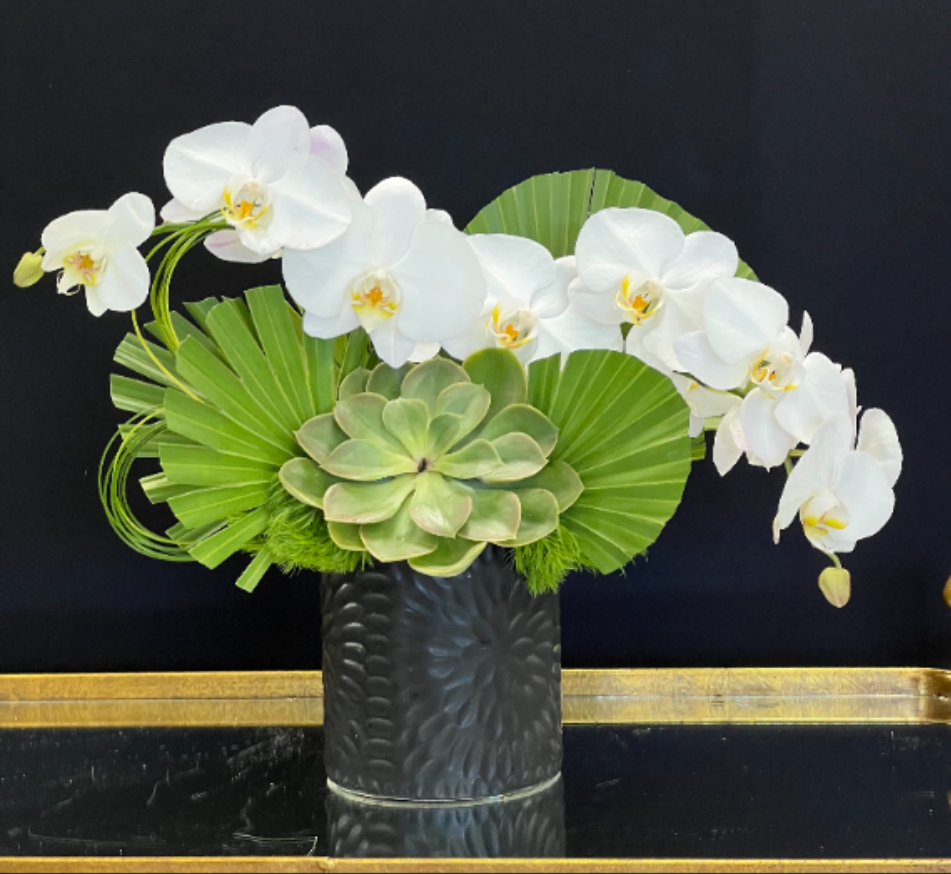 Las Palmas  - A petite, artfully designed arrangement of Phalaenopsis Orchids, Succulents, and Palm leaves