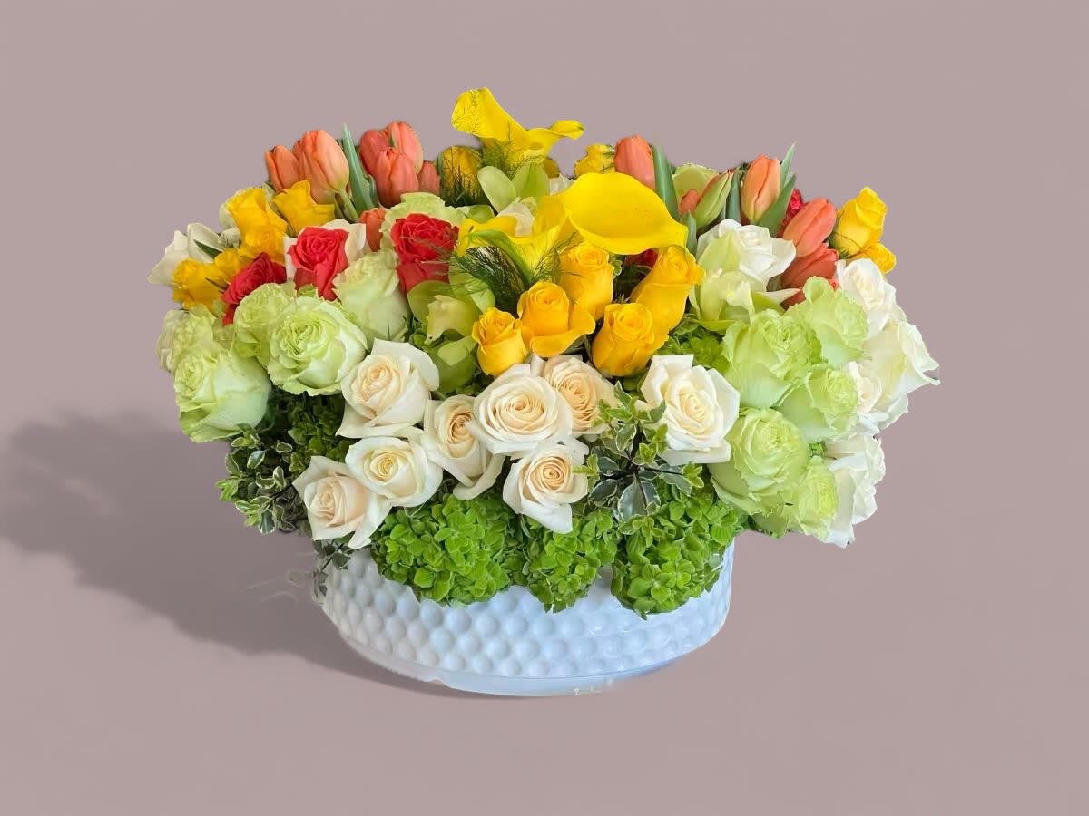 Honeydew - A bright, refreshing blend of Roses, Calla Lilies, Hydrangea, Tulips, and Cymbidium Orchids 