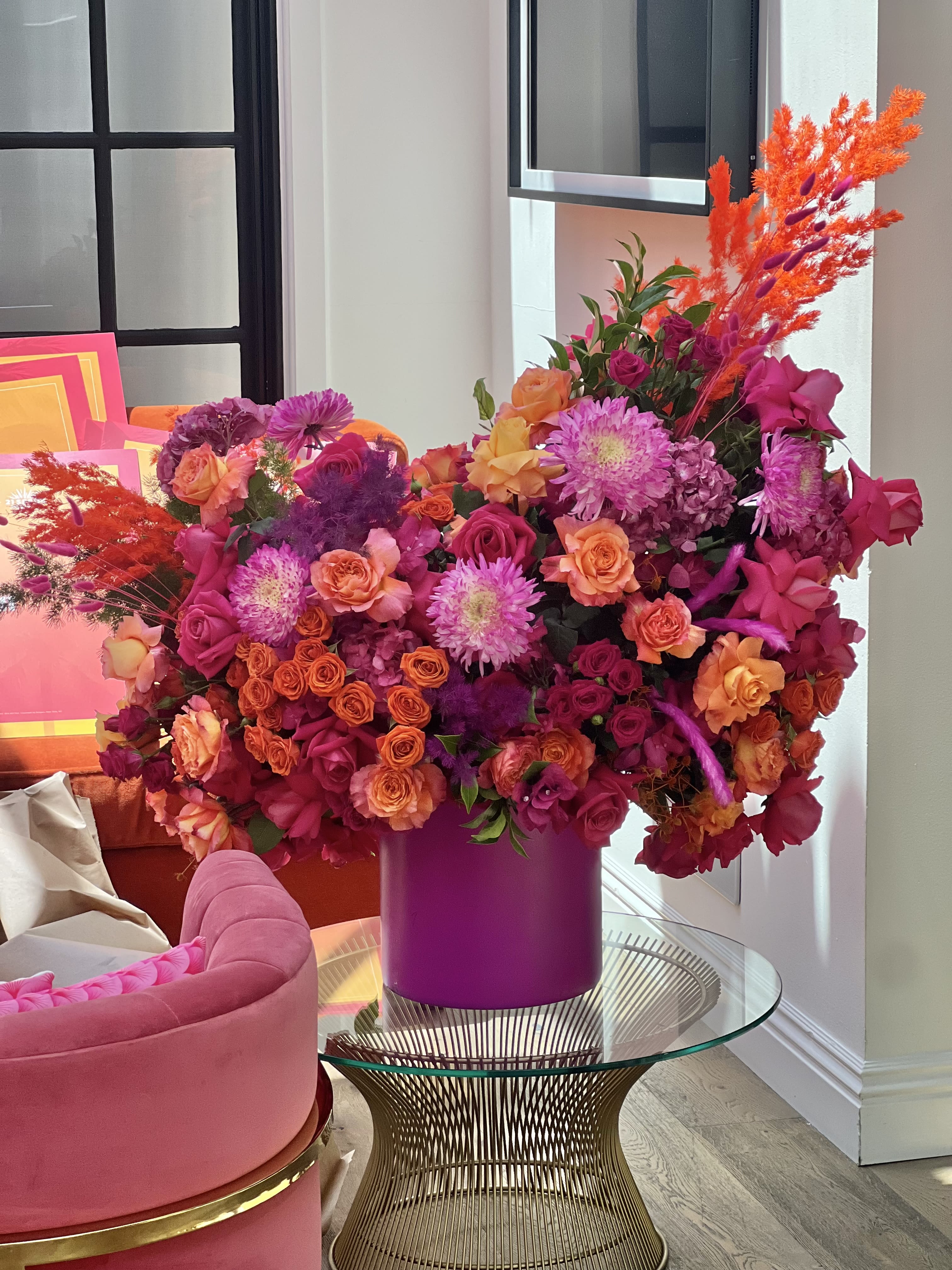 Radiante - This dazzling arrangement in orange and purple is sure to impress!