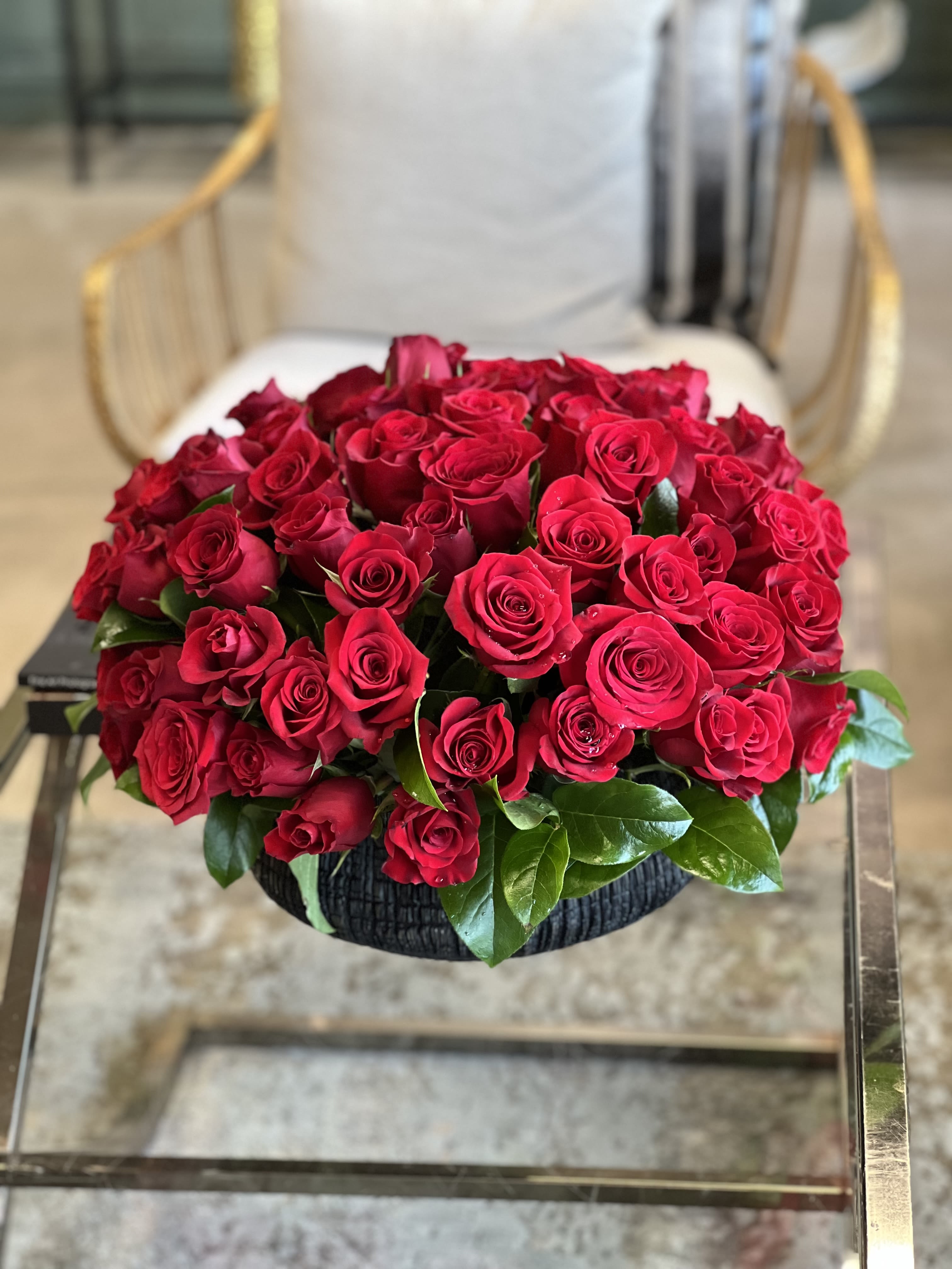 Lola - Vibrant red Roses in a low ceramic container