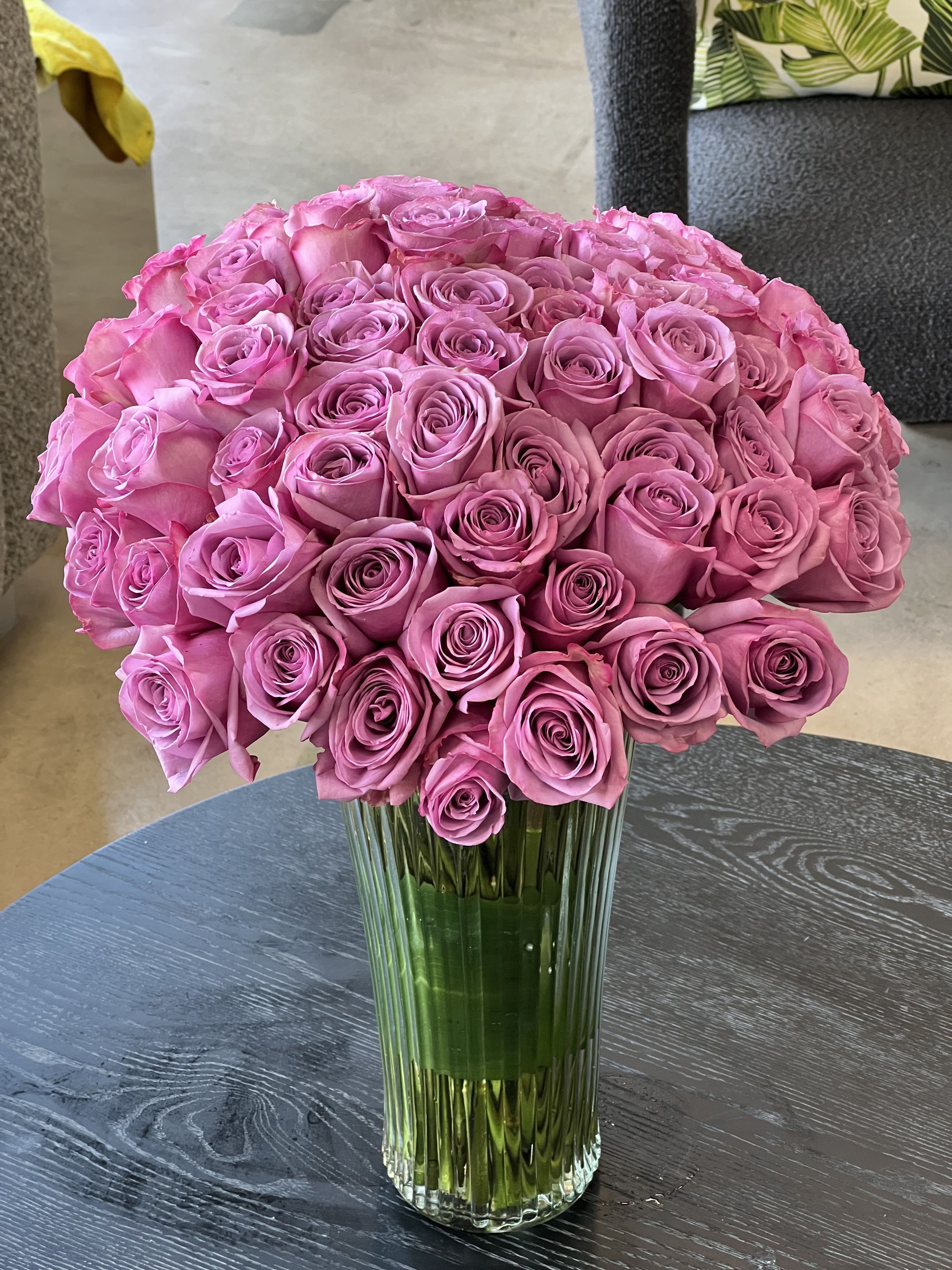 Cold Play  - A beautiful arrangement of purple Roses in a tall glass vase