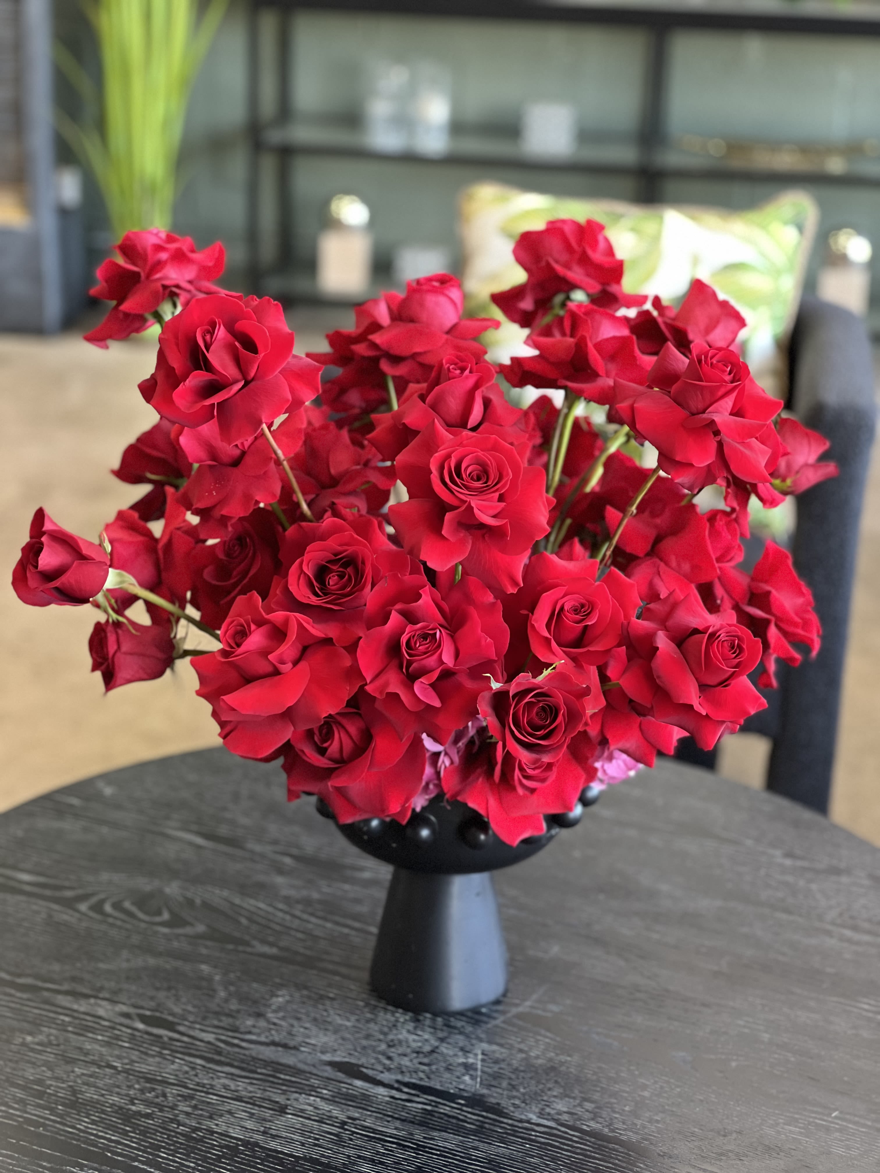 Natasha - A modern, impactful arrangement of reflexed red Roses for a dramatic statement of Love