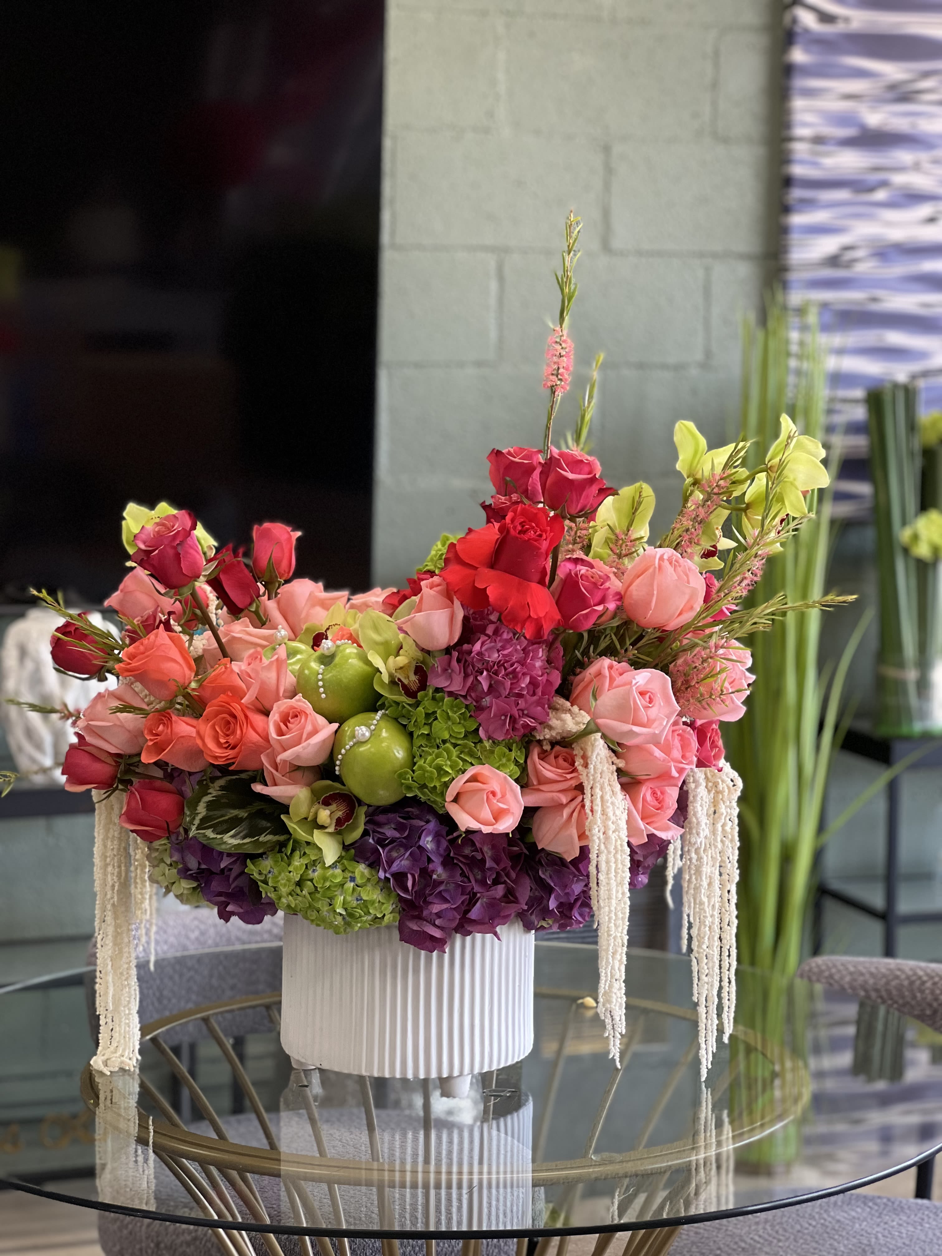 Tyranny  - A rich assortment of Roses, Cymbidium Orchids, Hydrangea, and other select blooms
