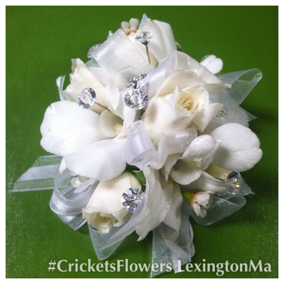 CWC15 all white bling corsage prom - A classic beauty that's perfect for proms, weddings, or to add elegance to any occasion. We hand-craft a gorgeous white rose corsage accented bling and with fresh greens to make her look radiant   ALL PROM FLOWERS MAY* REQUIRE 3 DAY NOTICE, WE WILL DO OUR BEST TO ACCOMINDATE LAST MINUTE ORDERS, BUT SOME SUBSITIONS MAY NEED TO BE MADE.  This can also be done in red, yellow, pink, lavender or peach. please specify color choice in special instructions.
