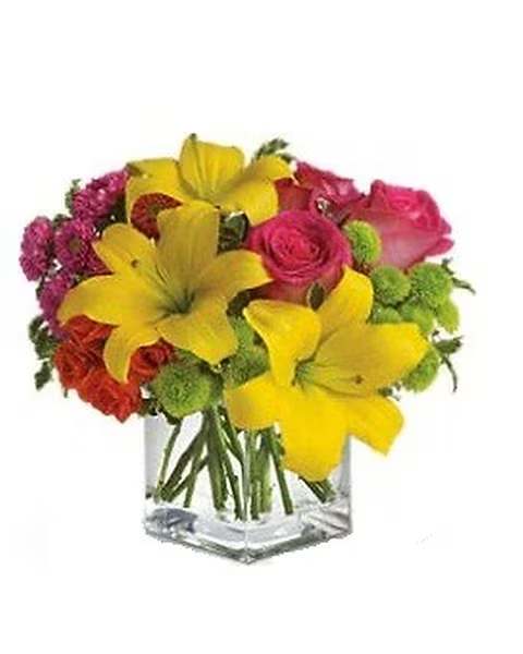 Sunsplash - Splash into summer! Sun-bright yellow, hot pink and orange blooms add up to a sensational and oh-so-stylish summer floral arrangement for any occasion.