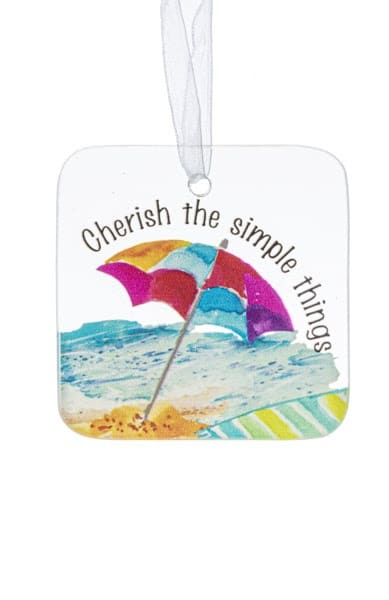 Square hanging ornament with beach umbrella illustration and the words 'Cherish the simple things'.