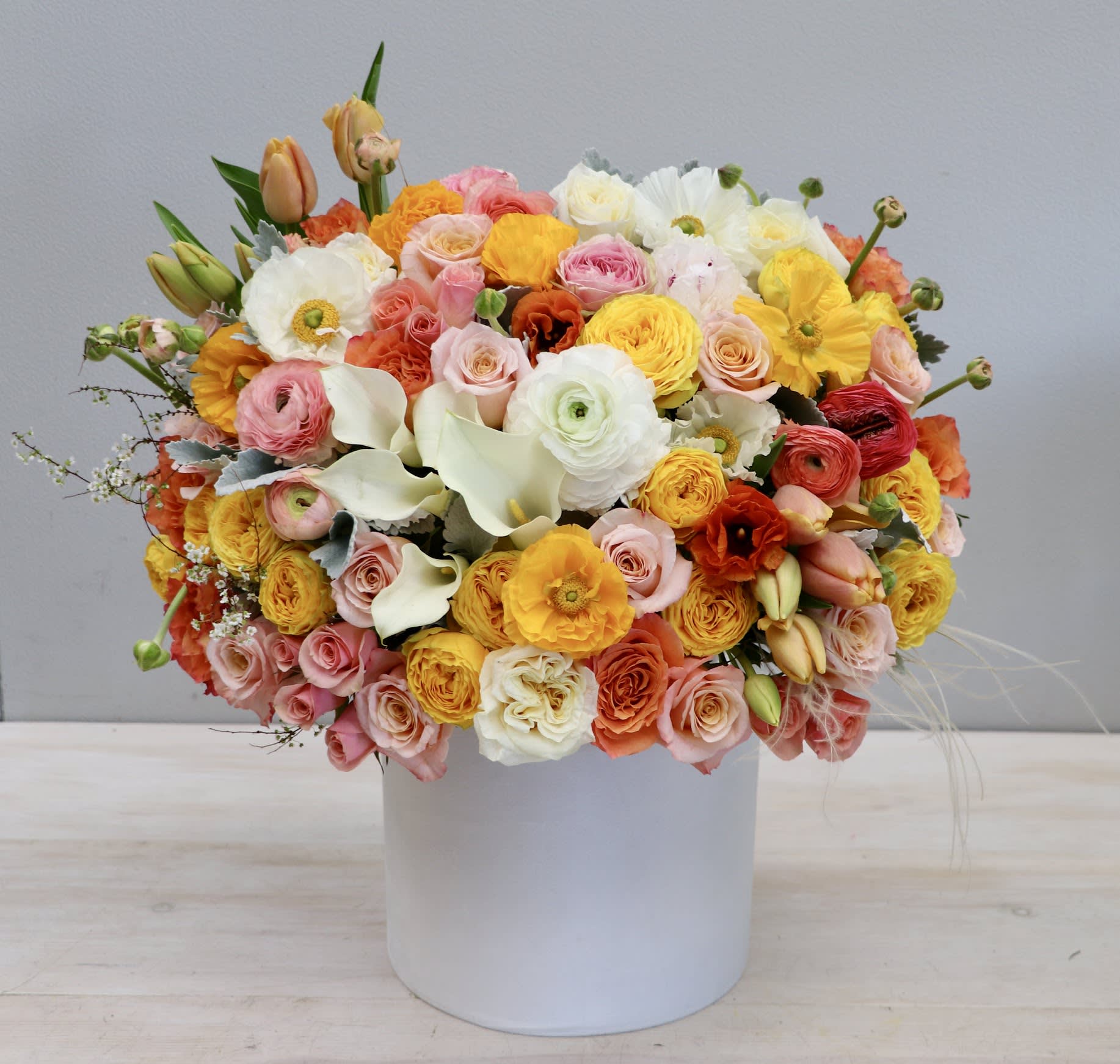 Everything Sweet - WeHo - Enjoy this arrangement all year long with yellow, pinks, and peach flowers. Approximate size of standard version is 18-20'' in height and width. 