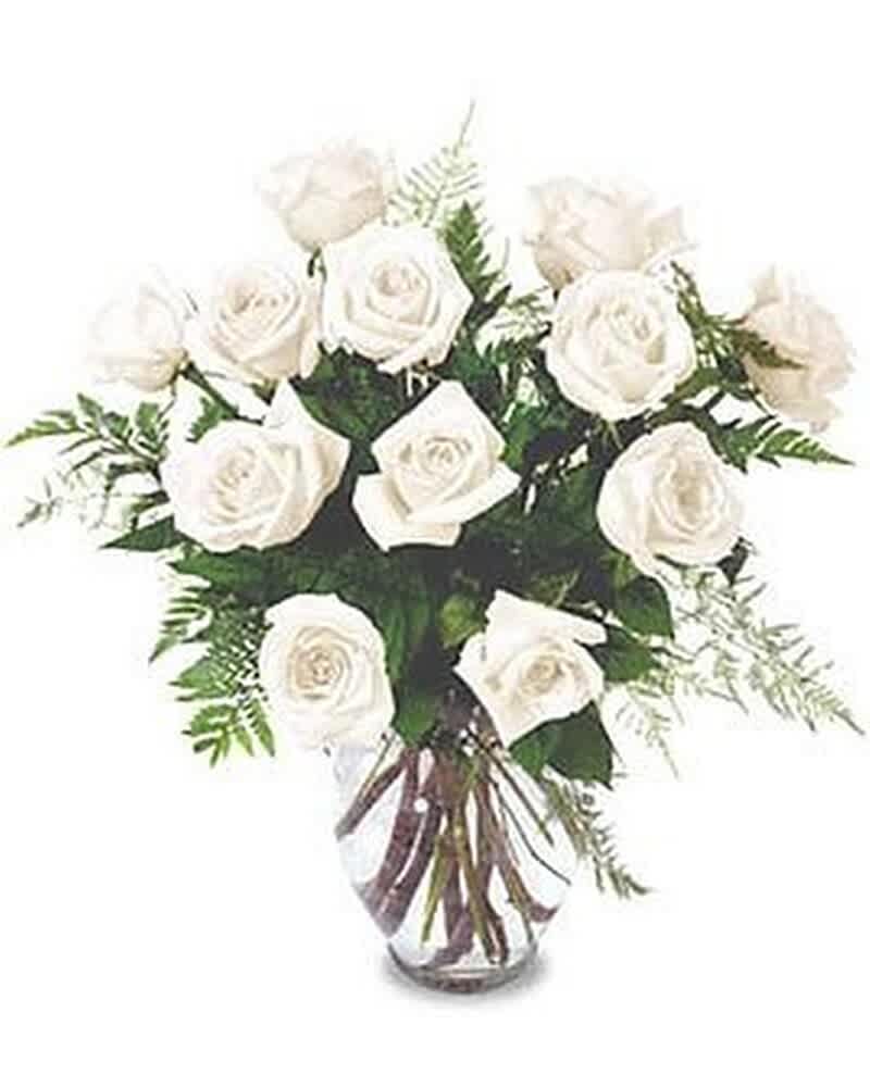 Arrangement of white roses in a clear glass vase
