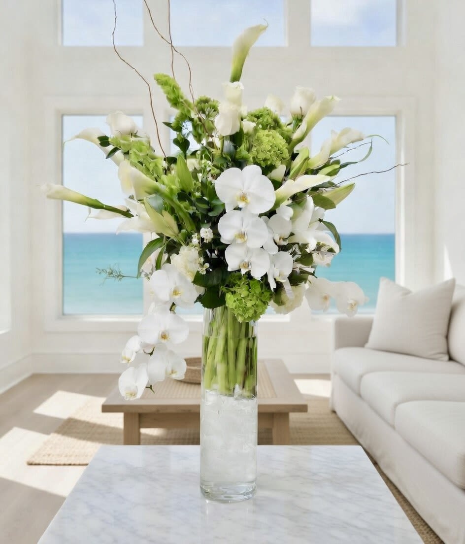 Zantedeschias Flower Bouquet - Zantedeschias Flower Bouquet: Tall and Elegant calla lilies arrangement accented with calla lilies, roses, greens, orchids and hydrangeas in a 20' tall clear cylinder vase and completed with a personalized card.