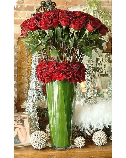 Hopelessly Devoted to You - Premium red roses, beautifully designed in a sleek glass vase.  