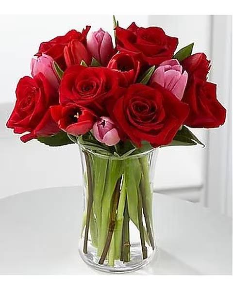 Let Love In - Let Love In Valentine's Day Bouquet by FTD speaks of romantic moments through rich color and dazzliing blooms. Our finest red roses mingle with bright red and popping pink tulips to create the perfect way to win their heart this coming Valentine's Day. 