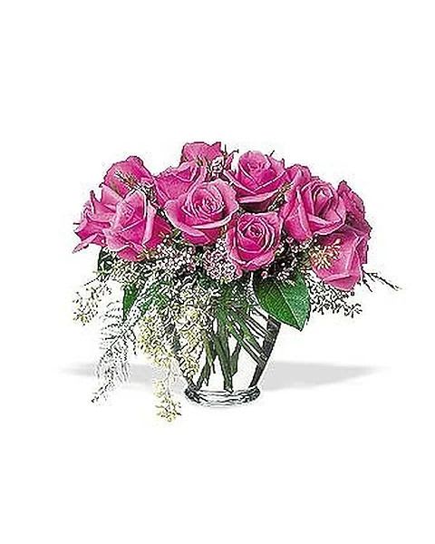 Lavender Roses - When you really want to wow them, send these distinctive, lovely roses. Twelve lavender roses with wax flower, eucalyptus and plumose in a classic glass vase. Standard 18 short stemmed roses Deluxe 24 Short Stemmed roses Premium 36 short stemmed roses 