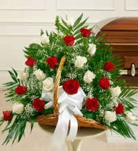 Classic Red &amp; White Rose Basket - A timeless and elegant floral basket featuring a beautiful blend of red and white roses, accented with fresh greenery and delicate baby’s breath or white asters depending on availability. This classic color combination symbolizes love, respect, and remembrance, making it a thoughtful choice for many occasions including sympathy or heartfelt gifting.  Arranged in a charming basket, this design offers a graceful and meaningful floral display.