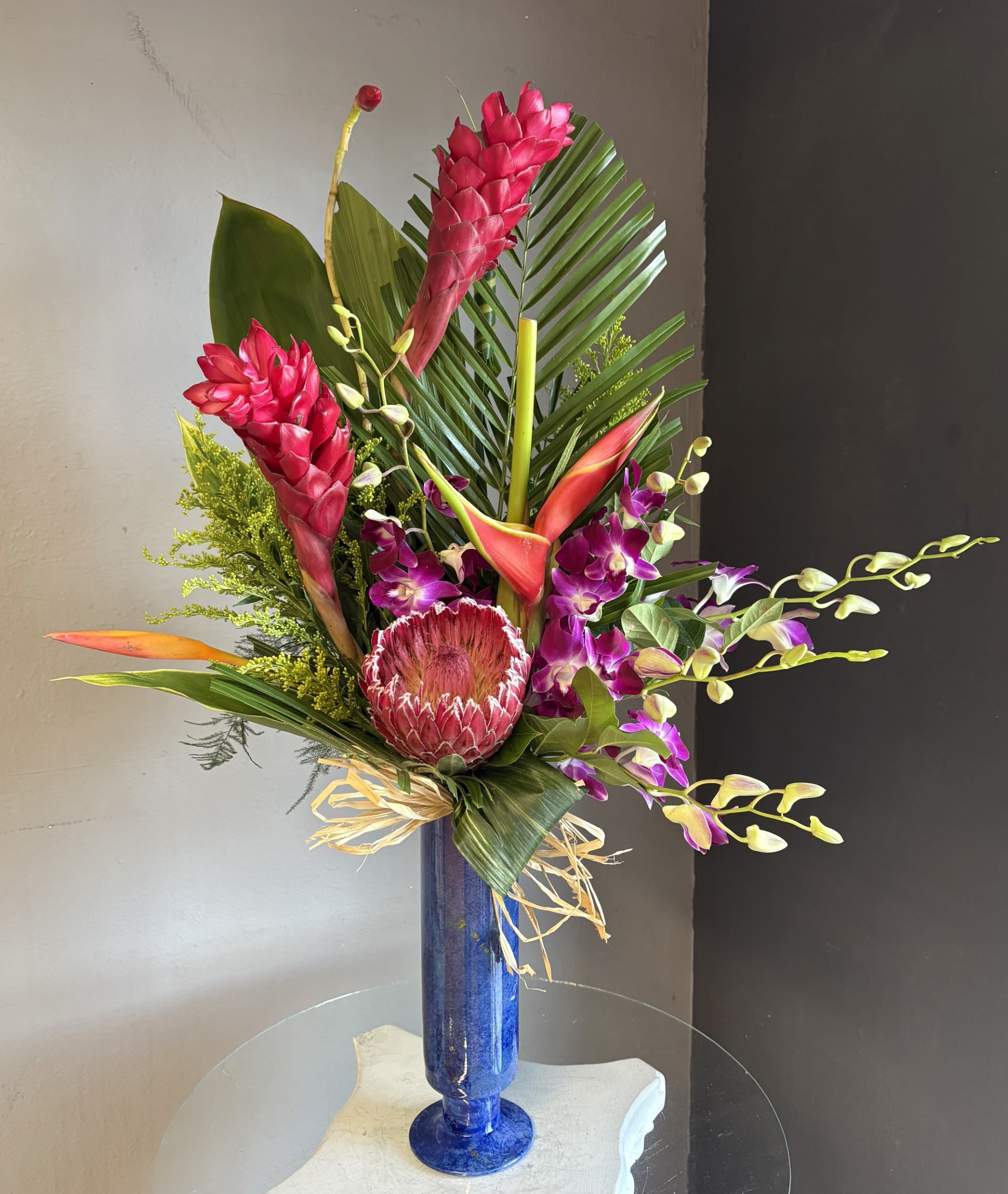 #730 Designer's Choice Vase Arrangement -  This beautiful flower arrangement of fresh mixed seasonal blooms is made by local designers in the heart of Orange California. Hand crafted and perfect for every occasion, from birthdays and new babies to sympathy and just because. The best choice to show you are thinking of that special someone. Can be sent as a local delivery or in-store pickup. This is an original, one of a kind arrangement. Order now before it's too late!  UPGRADES: All upgrades are applied at the designer’s discretion and fulfilled to value using the freshest seasonal and/or premium flowers available. Container upgrades may be included when possible; otherwise, value is reflected in the floral selection while maintaining the original design style. 