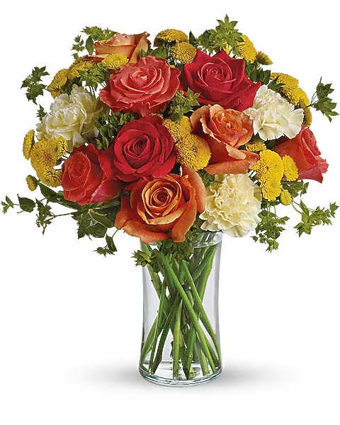 Citrus Kissed - Like freshly squeezed lemonade on a hot sunny day, this bright and cheerful bouquet is a summer sensation.  Dark orange, coral and orange roses, light yellow carnations, yellow button spray chrysanthemums and greens fill a slender gathering vase. It's a kiss of summer!  Approximately 11" W x 14" H