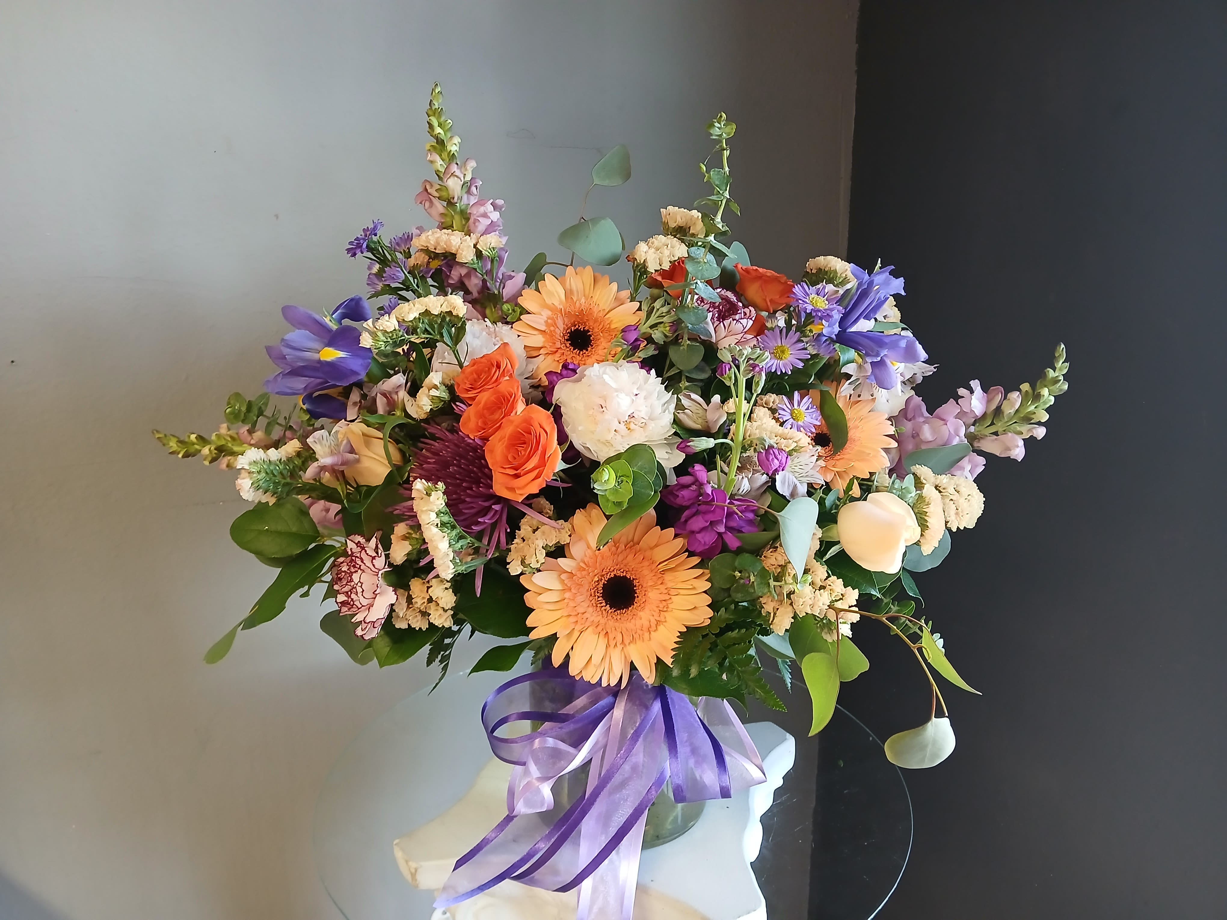 #722 Designer's Choice Vase Arrangement - This beautiful flower arrangement of fresh mixed seasonal blooms is made by local designers in the heart of Orange California. Hand crafted and perfect for every occasion, from birthdays and new babies to sympathy and just because. The best choice to show you are thinking of that special someone. Can be sent as a local delivery or in-store pickup. This is an original, one of a kind arrangement. Order now before it's too late!  UPGRADES: All upgrades are applied at the designer’s discretion and fulfilled to value using the freshest seasonal and/or premium flowers available. Container upgrades may be included when possible; otherwise, value is reflected in the floral selection while maintaining the original design style.