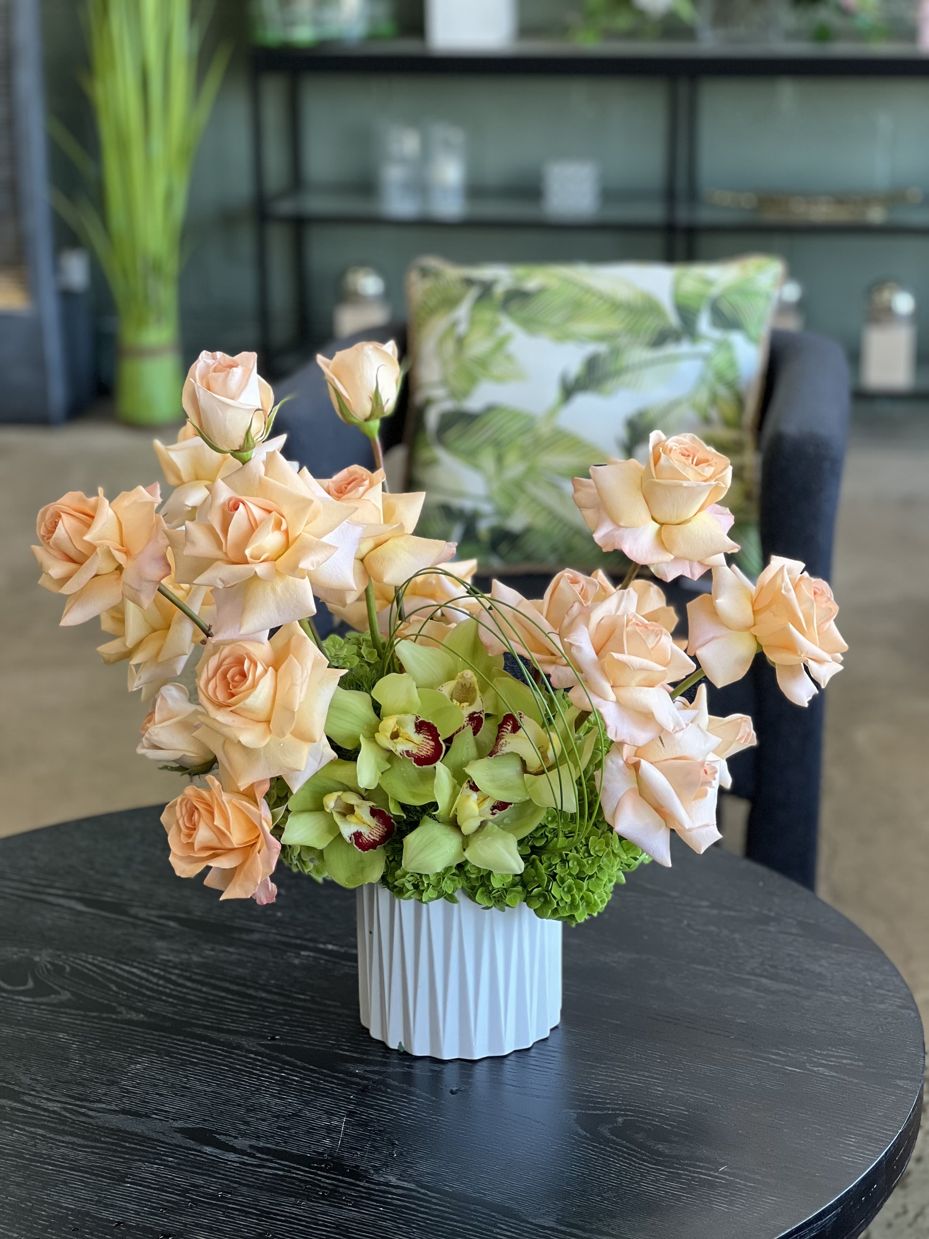 Dana - A dazzling display of reflexed Roses, with Cymbidium Orchids and Hydrangea, finished with Bear Grass