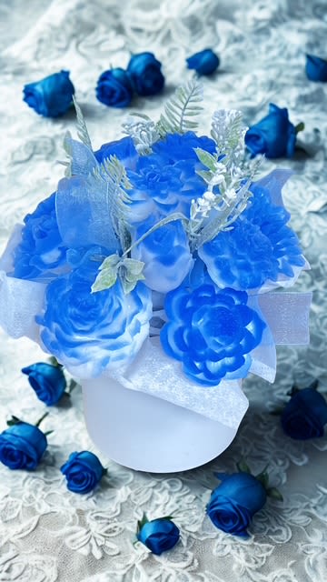 Blue Sky - In a ceramic vase blue and white candle flowers