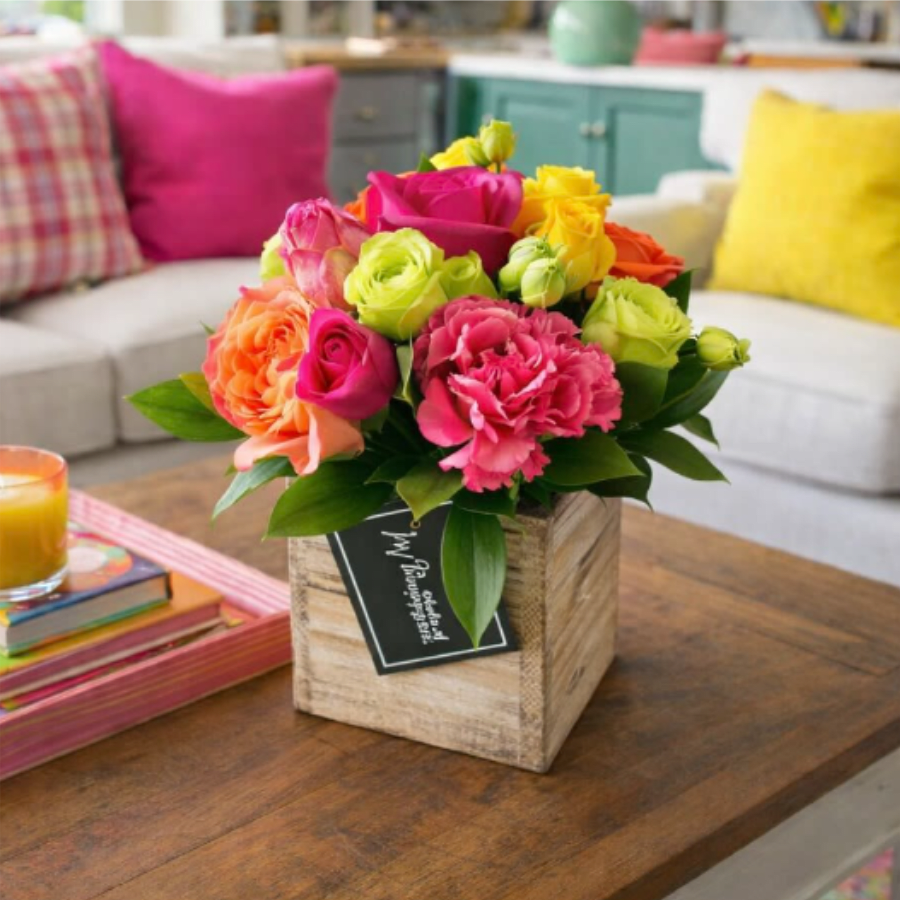 Crush (Petite) - Crush Petite Arrangement – Bold, Bright &amp; Beautiful  Turn up the color with our Crush Petite Arrangement, a compact yet striking floral display designed to make a big impression. Bursting with vibrant hues of hot pink, sunny yellow, lime green, and bold orange, this cheerful mix of roses, lisianthus, tulips, and velvety cockscomb is artfully arranged in a rustic wooden box for a modern, stylish finish.  Perfect for surprises, thank-you gifts, or adding a pop of color to your home décor, this petite design delivers all the charm of a larger bouquet in a perfectly sized package. Its long-lasting blooms and bold palette make it an unforgettable choice for anyone who loves bright, uplifting flowers.