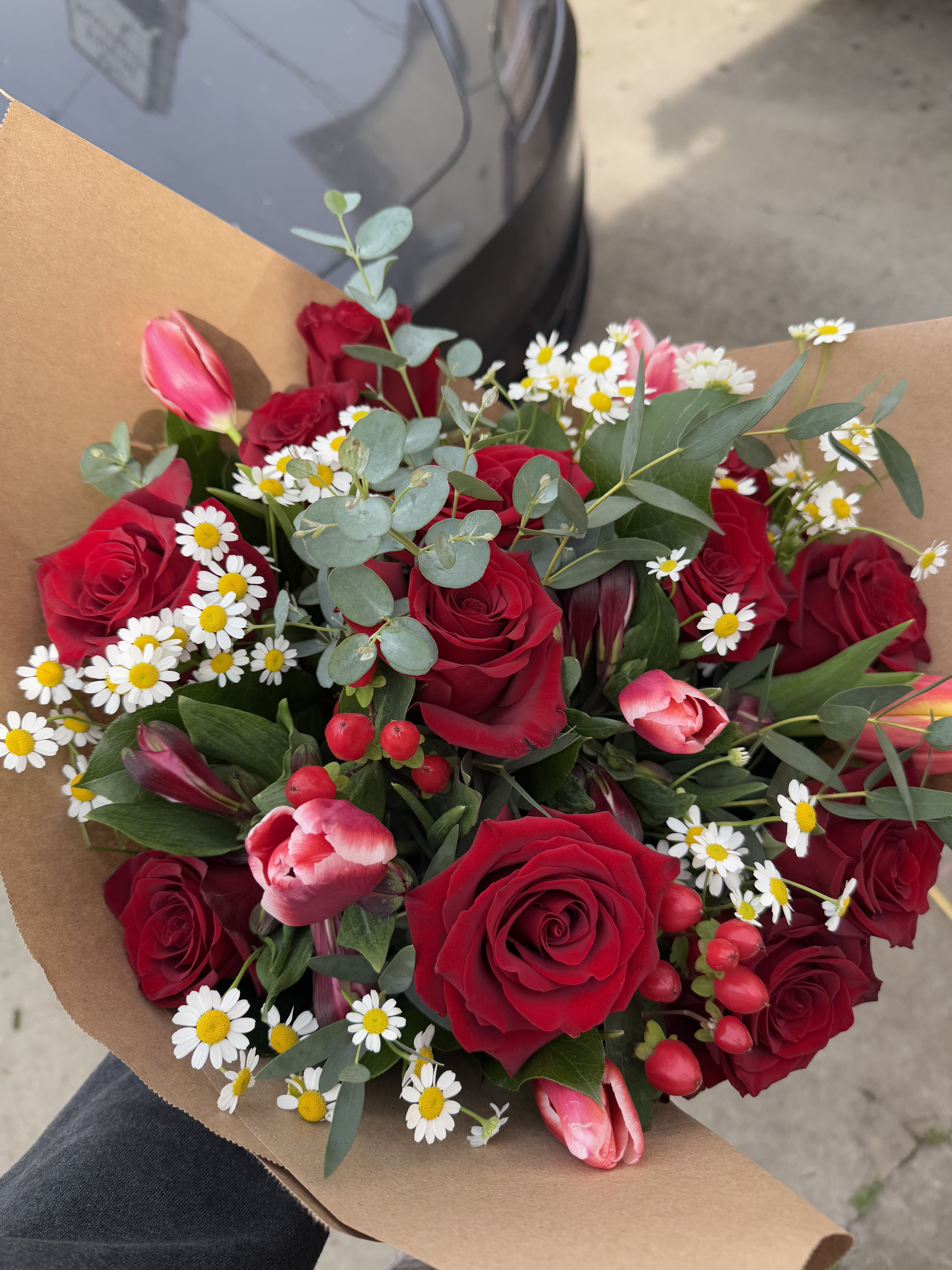 Love, Me.  - Hand wrapped bouquet with Roses, tulips, and fillers. Please note tulips are short stem, and blooms may be substituted.  