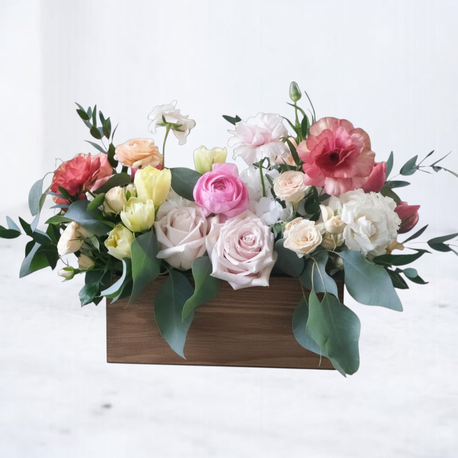 Sienna Mood - Warm, textural, and effortlessly refined, Sienna Mood blends soft blush, creamy ivory, and muted peach tones with natural greenery for a grounded, modern look. Designed in a sleek wooden container, this arrangement features seasonal blooms like roses, ranunculus, and specialty accents arranged with airy movement and organic flow.  Perfect for birthdays, celebrations, or sending something elevated yet natural, this piece offers a fresh take on everyday flowers with a soft, earthy edge.  Whiskey Wallflower is a design-forward florist based in Magnolia, offering same-day flower delivery throughout Magnolia, Montgomery, The Woodlands, Conroe, Tomball, Willis, Spring, and surrounding North Houston communities. Each arrangement is thoughtfully composed using premium blooms, with a focus on modern design, quality, and intentional detail.
