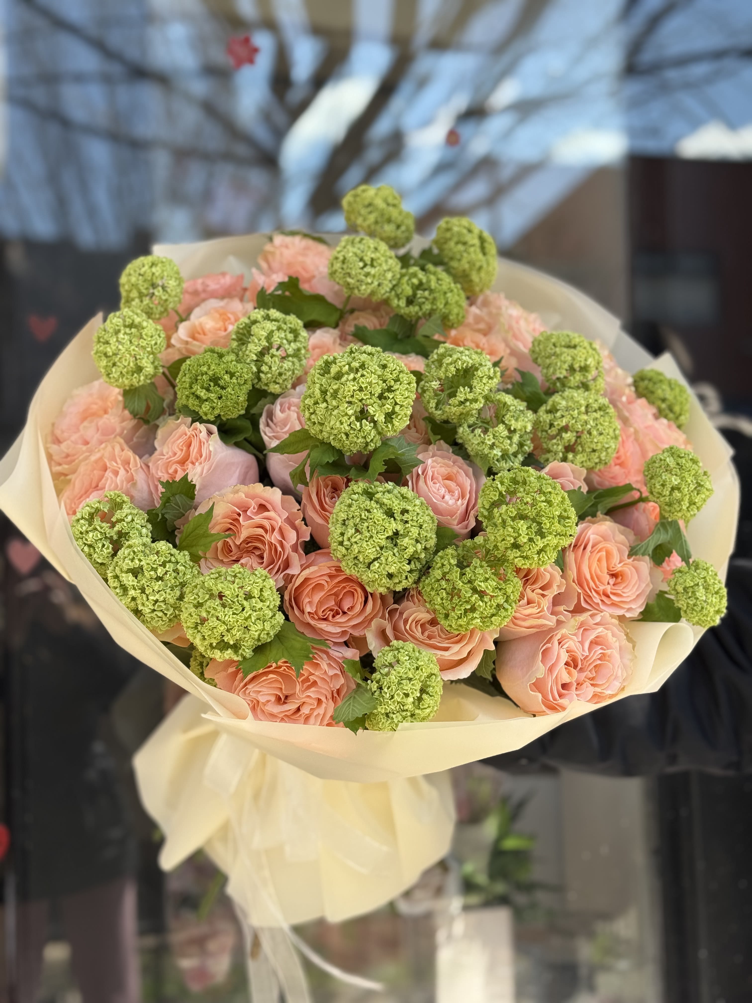Thinking Of You Bouquet.    The photo shows the deluxe size. - The photo shows the deluxe size. Standard 20 Roses and 10 Green Viburnum. Deluxe 30 Roses and 14 Green Viburnum. Premium 40 roses and 16 Green Viburnum.