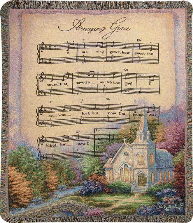 Decorative throw blanket with hymn lyrics and a church scene