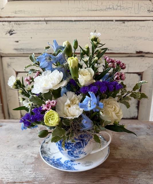 Your Cup of Tea - The blue and white pattern on this cup and saucer set is as lovely as the flower arrangement inside it! 