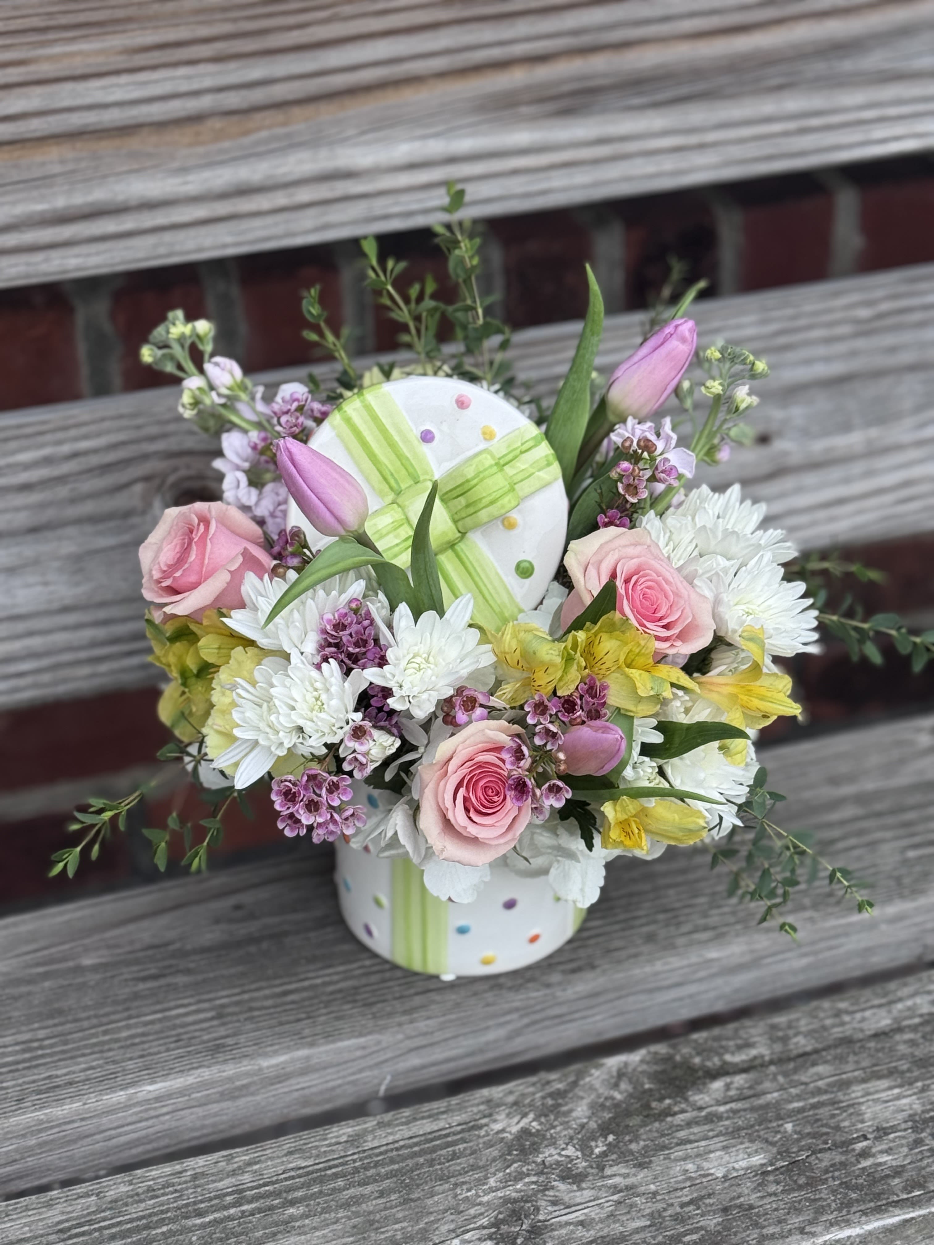 Blooming Gift  - A mix of pink roses, tulips, stock, white daisies and alstroemeria perfect to bring joy to any special occasion! Comes in a 5x5 polka-dotted vase.