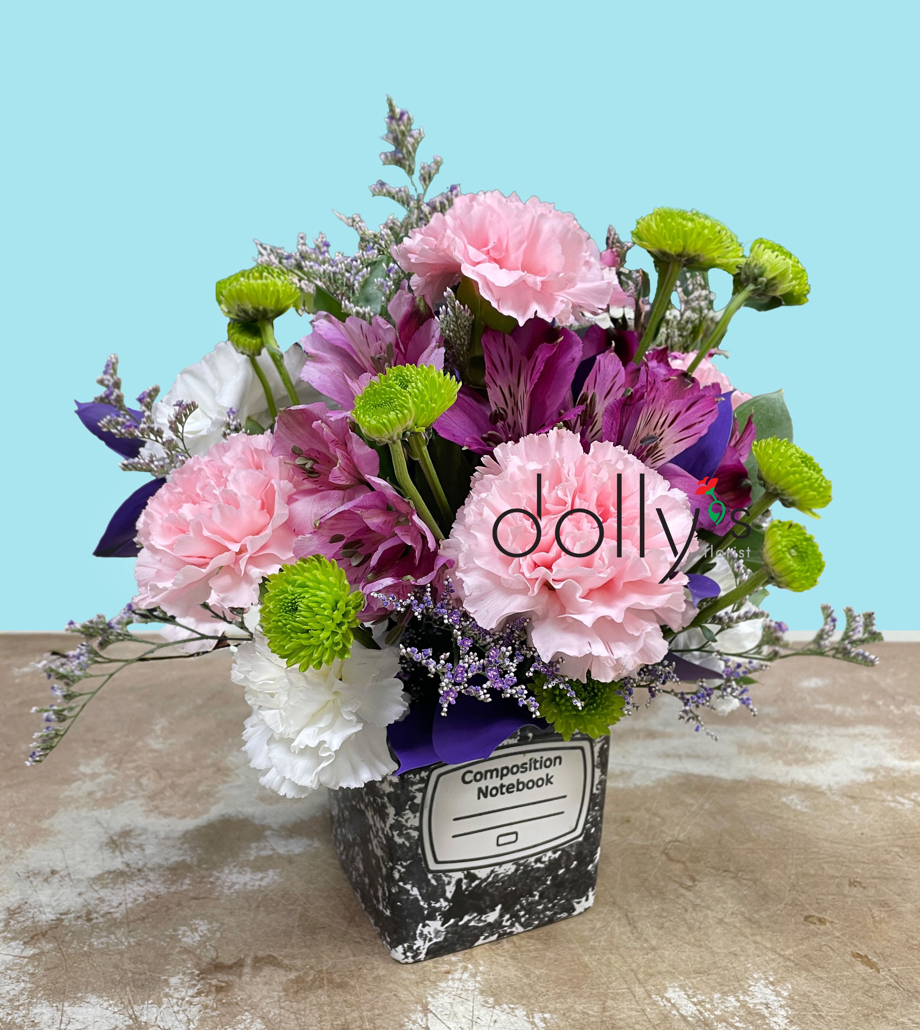 Ace The Day - Ideal for congratulating a recent grad, surprising a colleague during Admin Professionals' Week, or sending a spontaneous pick-me-up, this bouquet reads as casual, upbeat, and sincere he/she feel celebrated and seen. No special care is needed beyond fresh water; place on a stable surface out of direct sunlight to enjoy the colors for several days.  This mixed-color arrangement pairs large pink carnations, vibrant purple alstroemeria, crisp white blooms, and bright green button chrysanthemums for a lively contrast, with small ruscus filler flowers adding delicate texture around the edges. 