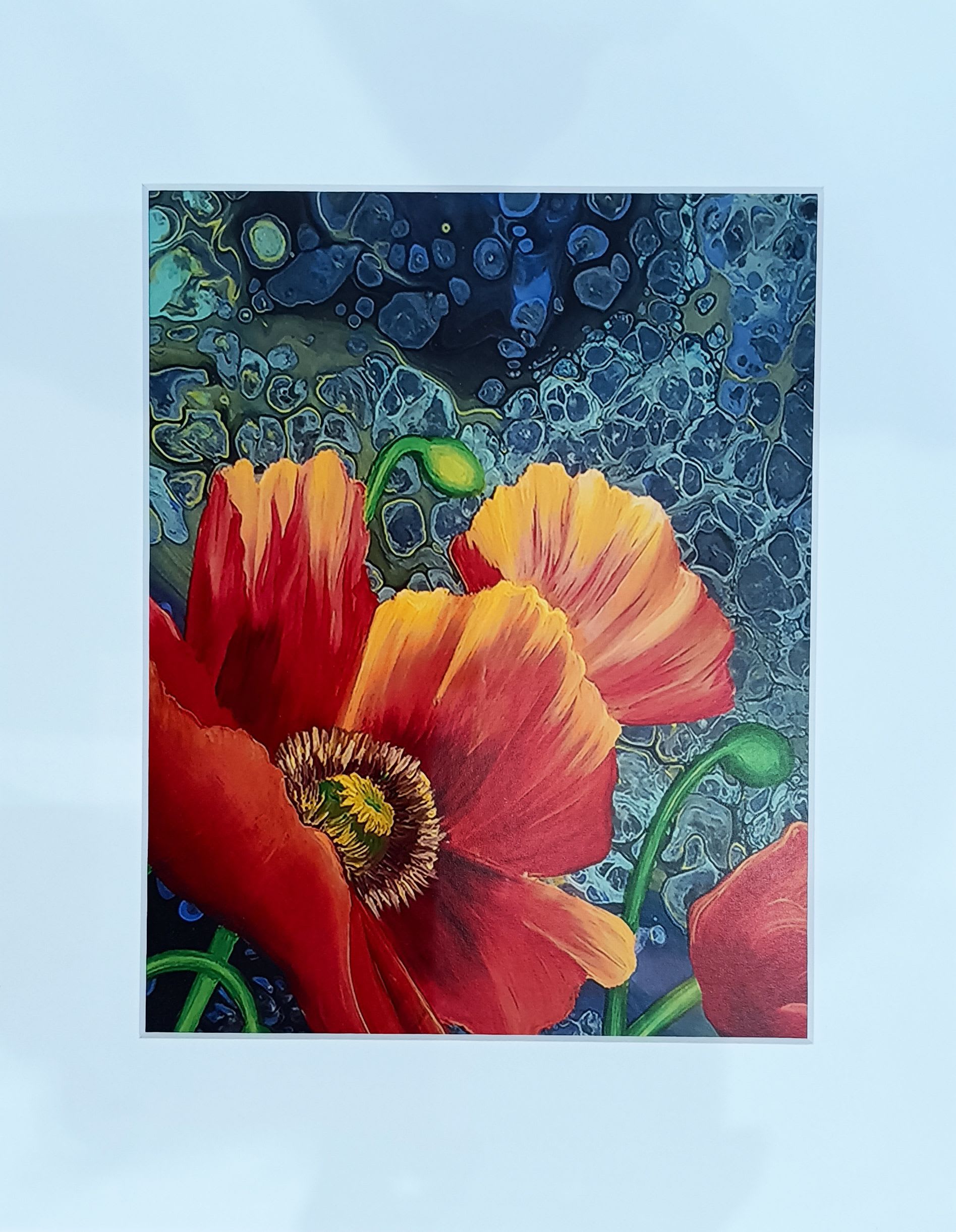 Framed art print of red and orange poppy flowers on an abstract blue background