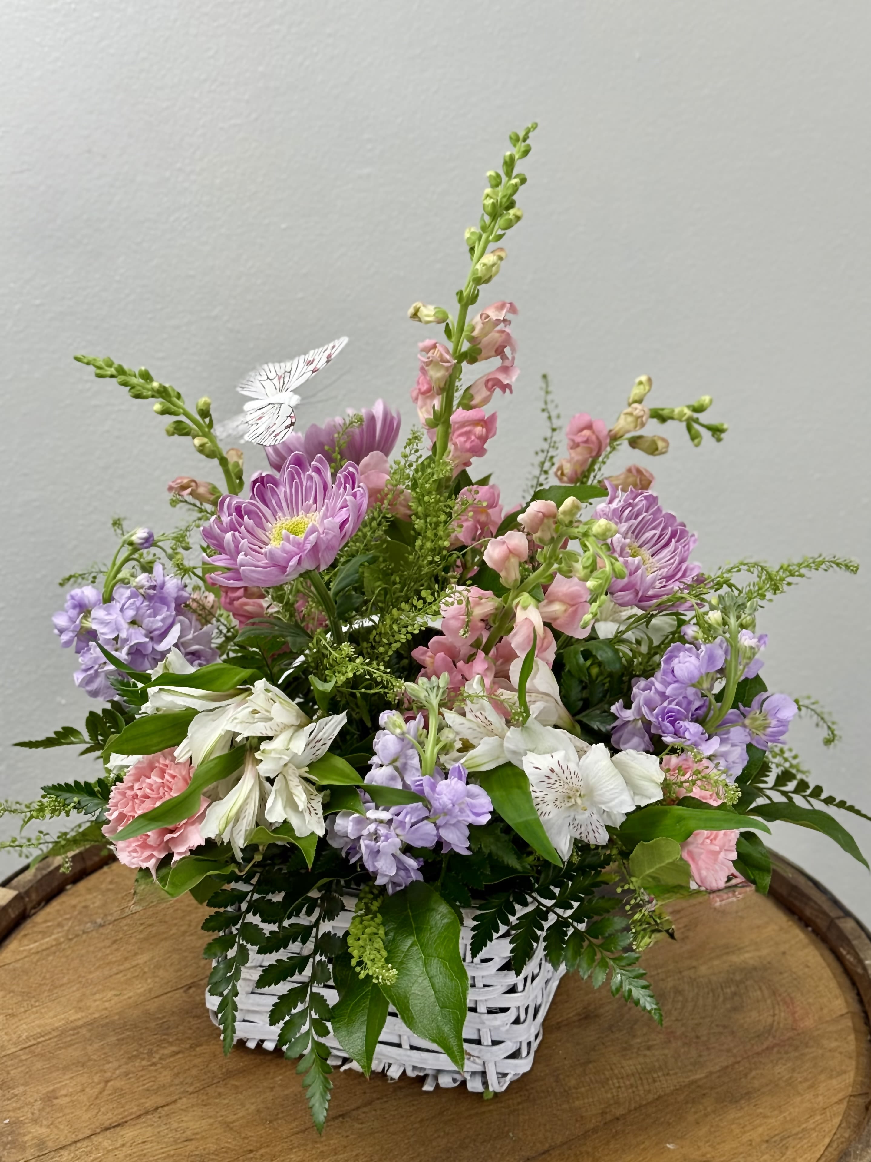 Storybook Blooms - "A little garden magic, gathered just for you." A dreamy, garden arrangement with soft pinks, gentle lilacs and creamy whites. Storybook Blooms feels like a quiet morning in a hidden cottage garden. Delicate textures whimsical stems come together in a design that's equal parts romance and nostalgia.