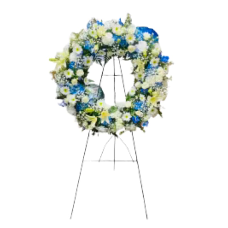 A touch of blue wreath - A beautiful rwreath of mix blue and white flowers perfect way to show your condolence