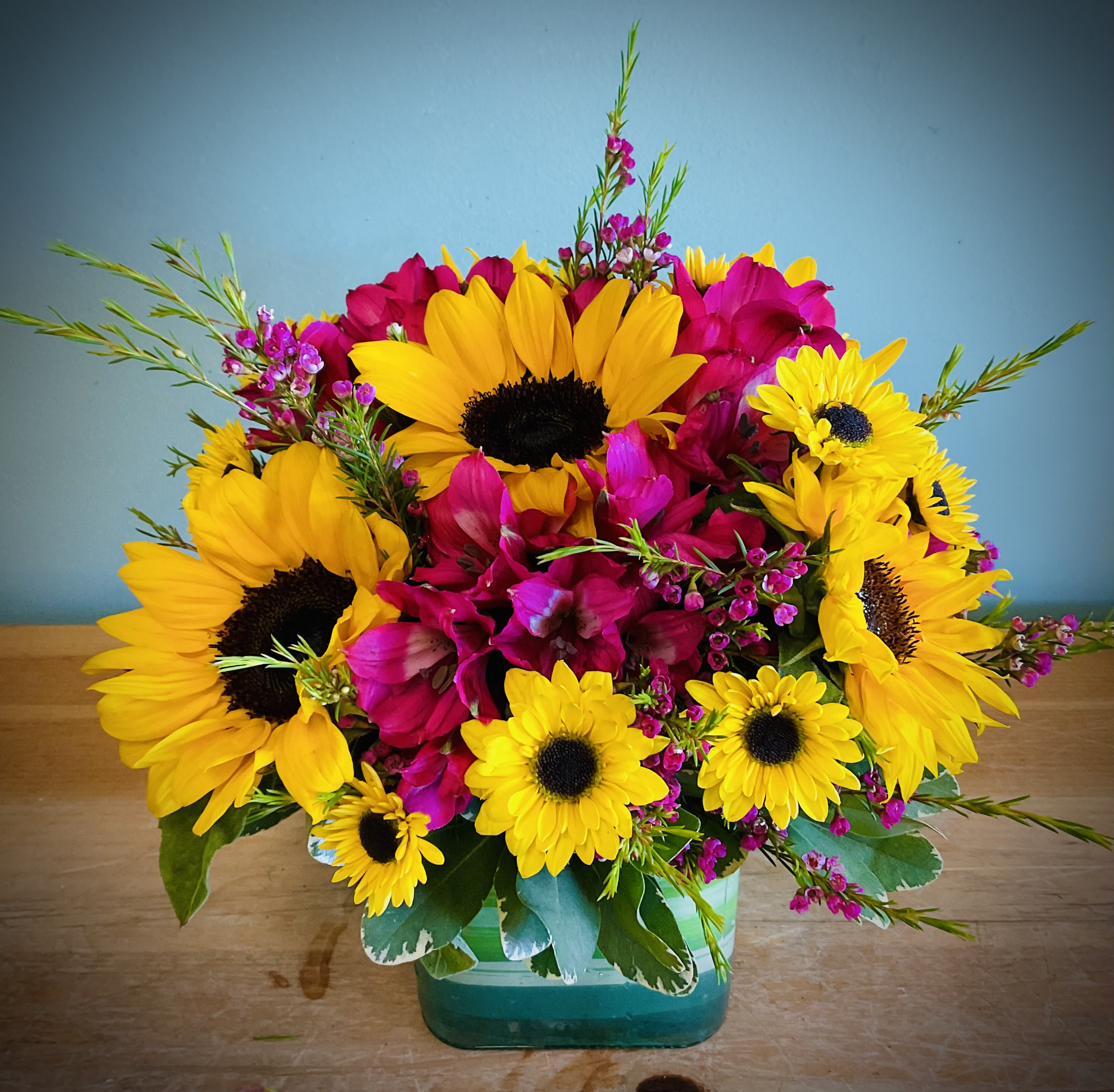 Always Sunny in Colorado  - Fill you home with more sunshine. We blessed with 245/ or more days of sun, so bring more sunshine into you home with this beautiful arrangement.  Filled with Sunflowers and different color of Alstroemeria, and the freshest additional flowers in a variety of colors.