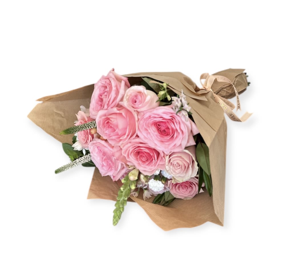 Pink rose bouquet wrapped in brown paper