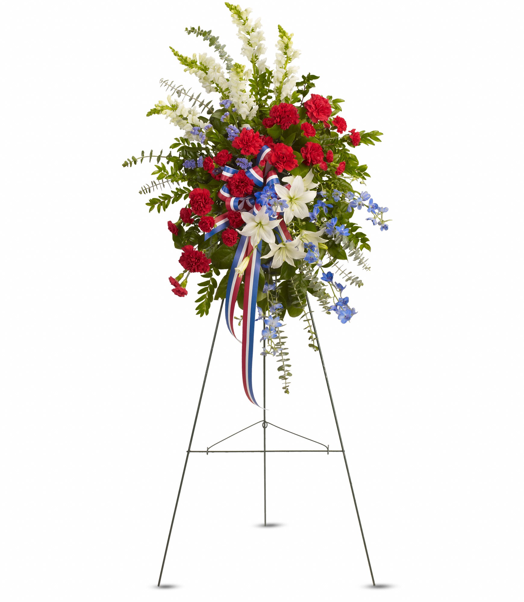 Standing floral spray with red, white, and blue flowers on an easel