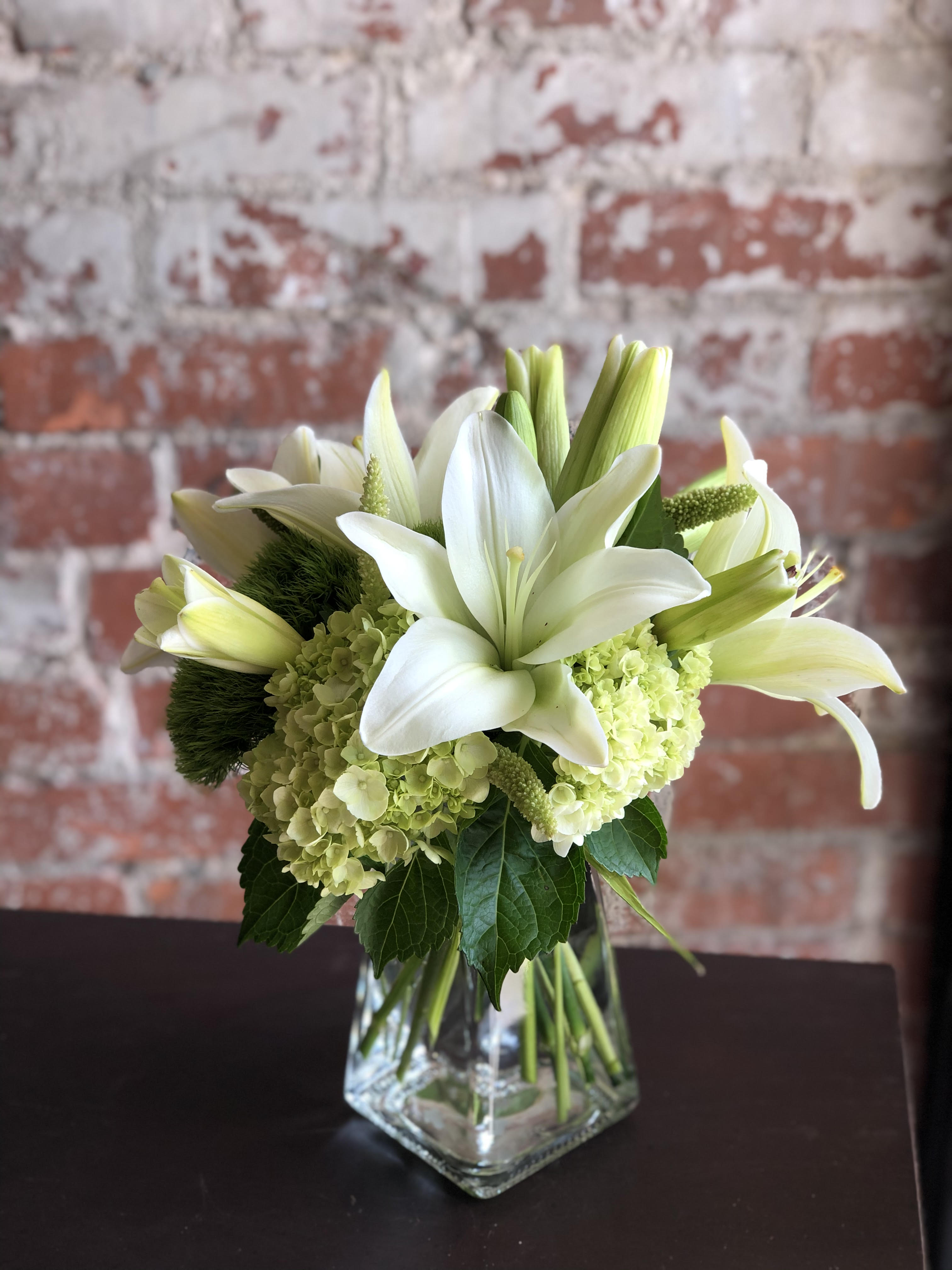 Lime Delight - This crisp and fresh arrangement of white and green blooms will add elegance and grace to any occasion. 