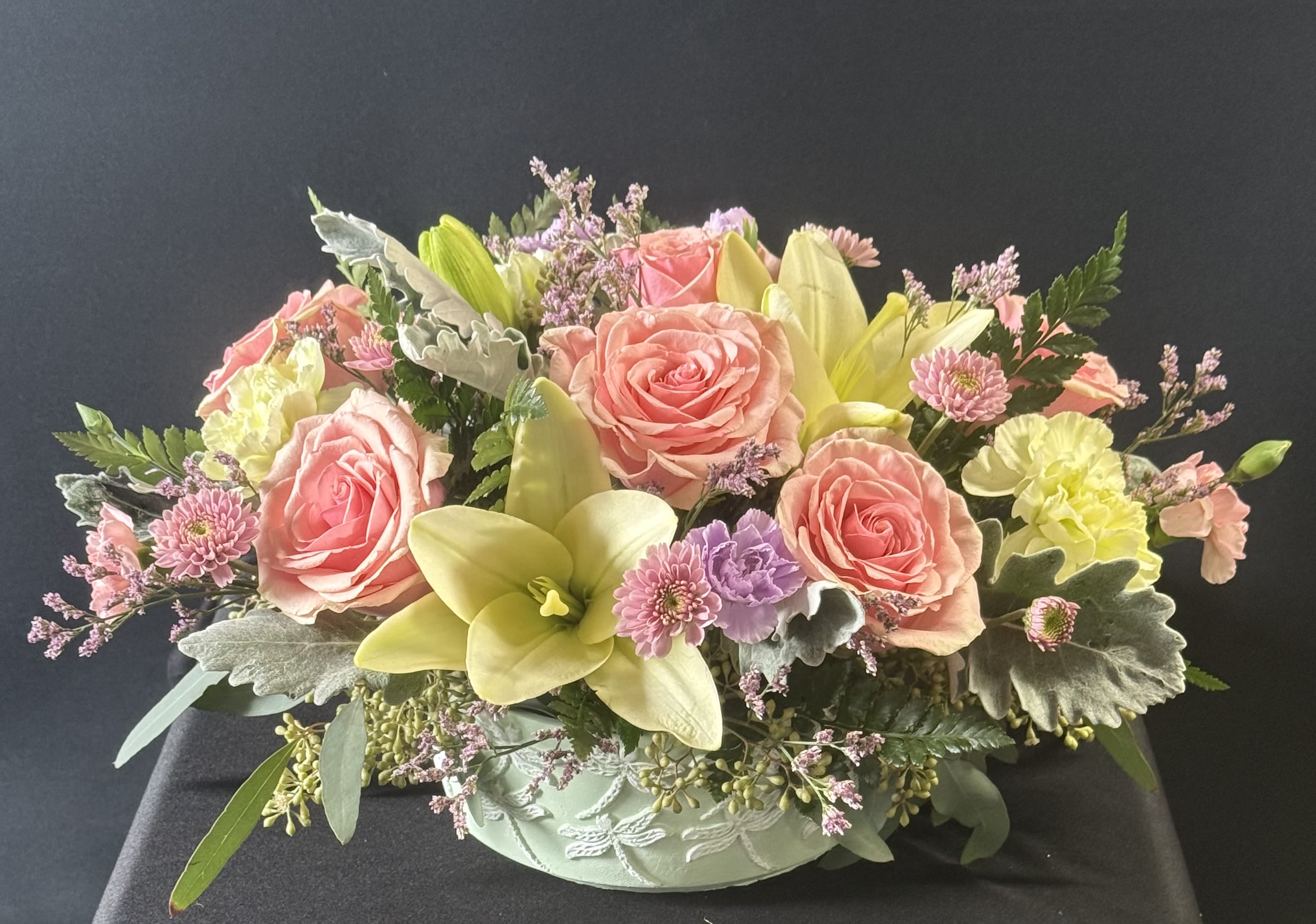 Dragonfly Daydream - Pastel flowers in a mint green ceramic dragonfly container