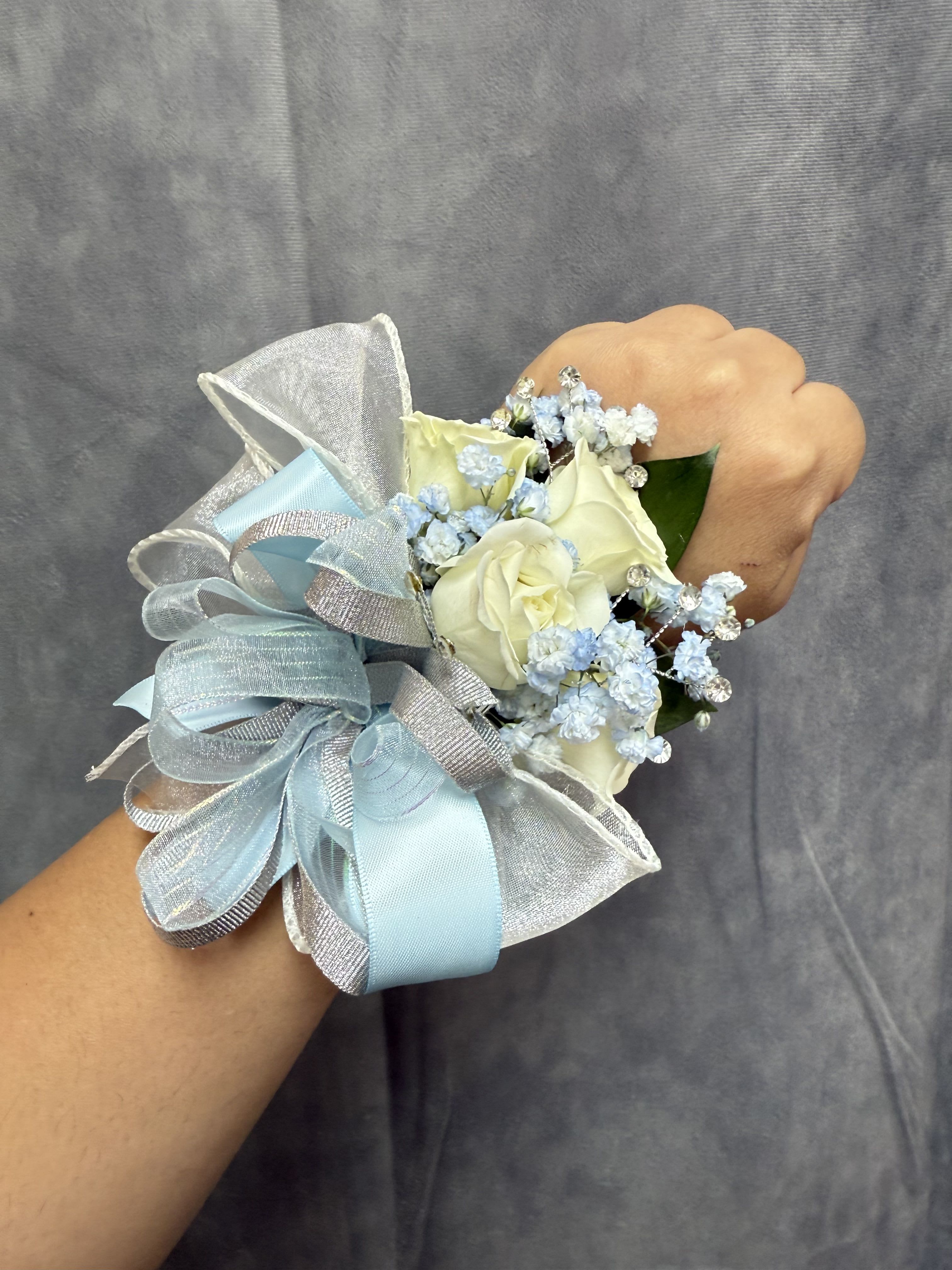 Baby blue Silver White spray roses corsage - White spray roses With silver and baby blue ribbon wrist corsage with silver accents and pearl bracelet 