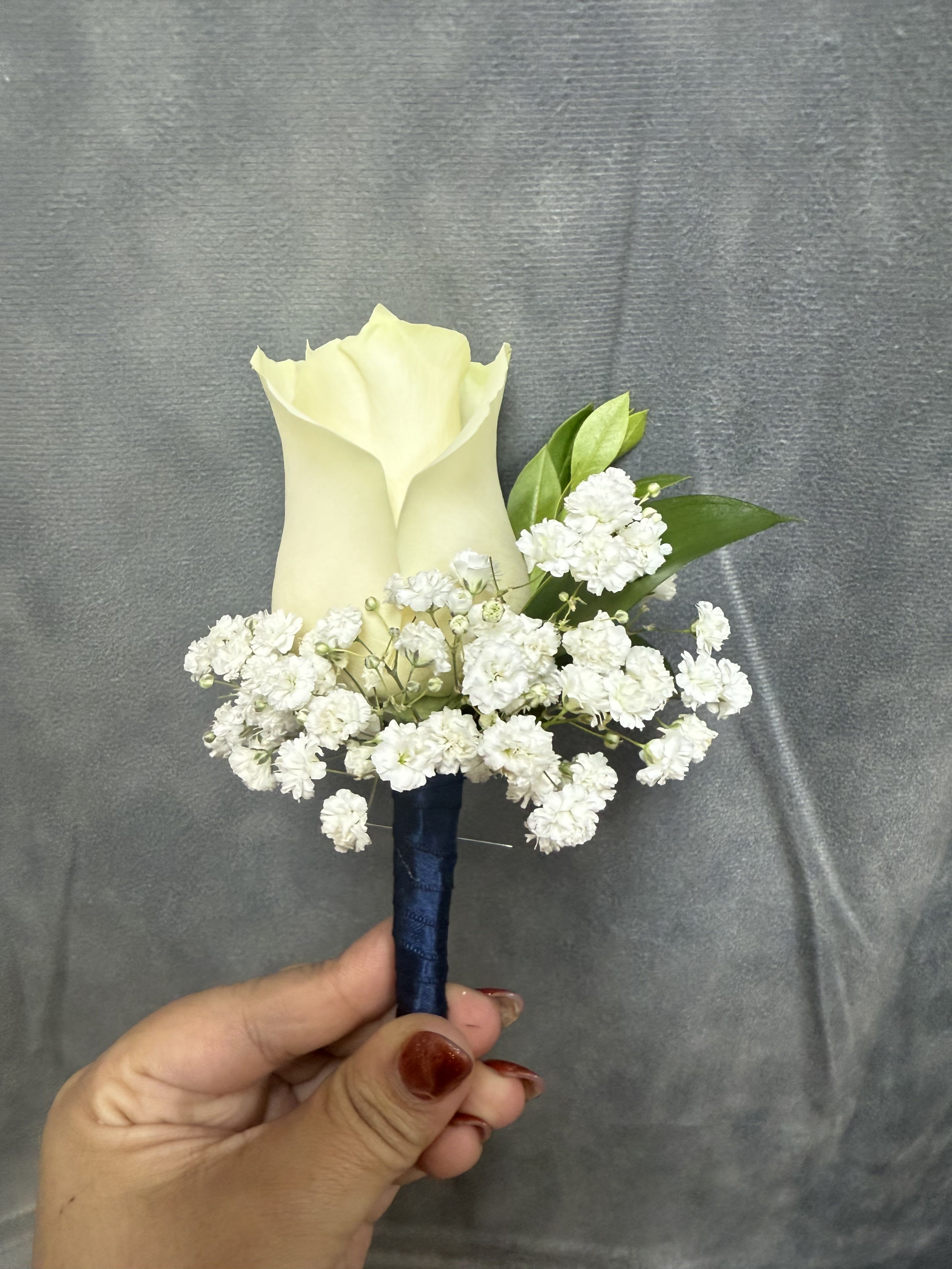 Navy White rose boutonnière  - White rose boutonnière with baby breath wrapped with navy ribbon 