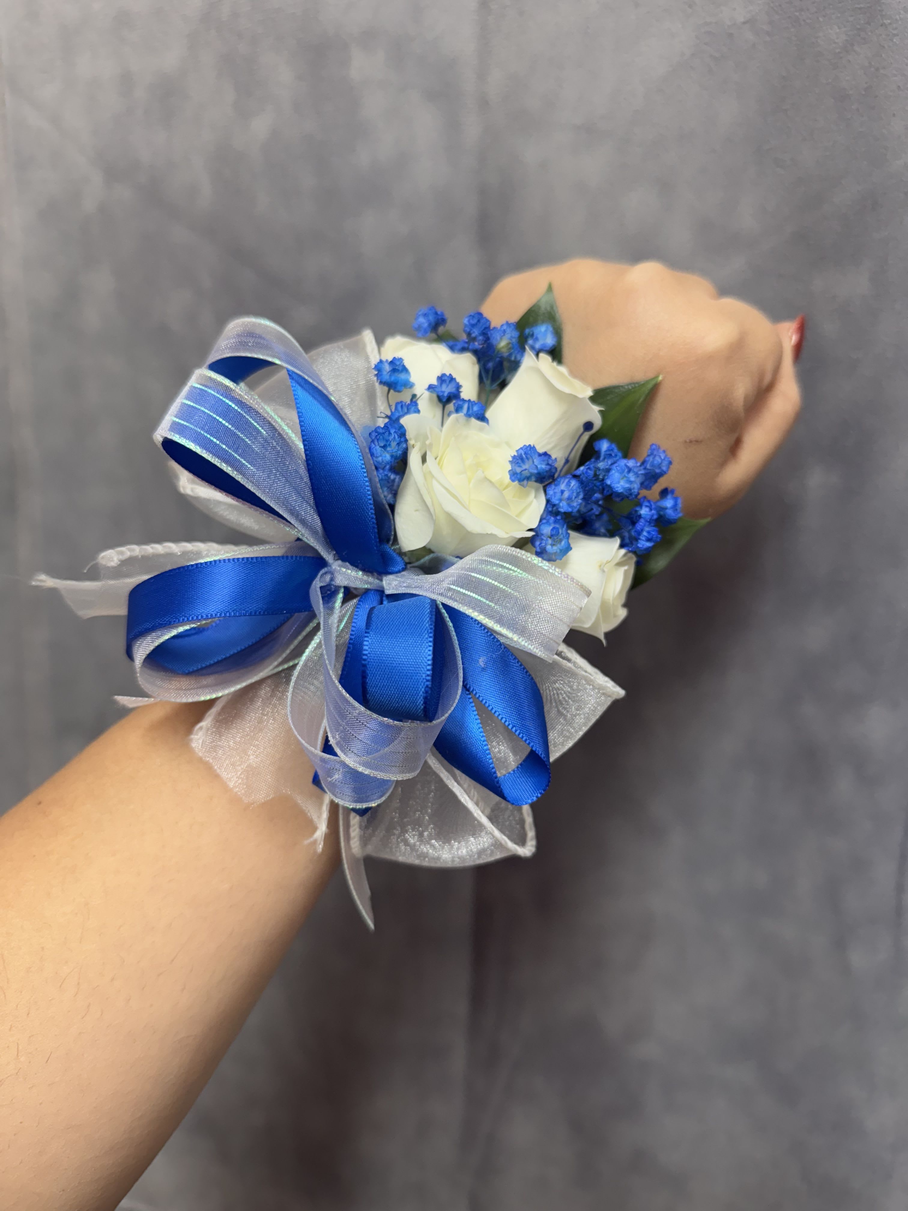 Royal blue white spray roses wrist corsage  - White spray roses with royal blue baby breath , white &amp; royal blue ribbon wrist corsage with pearl bracelet 