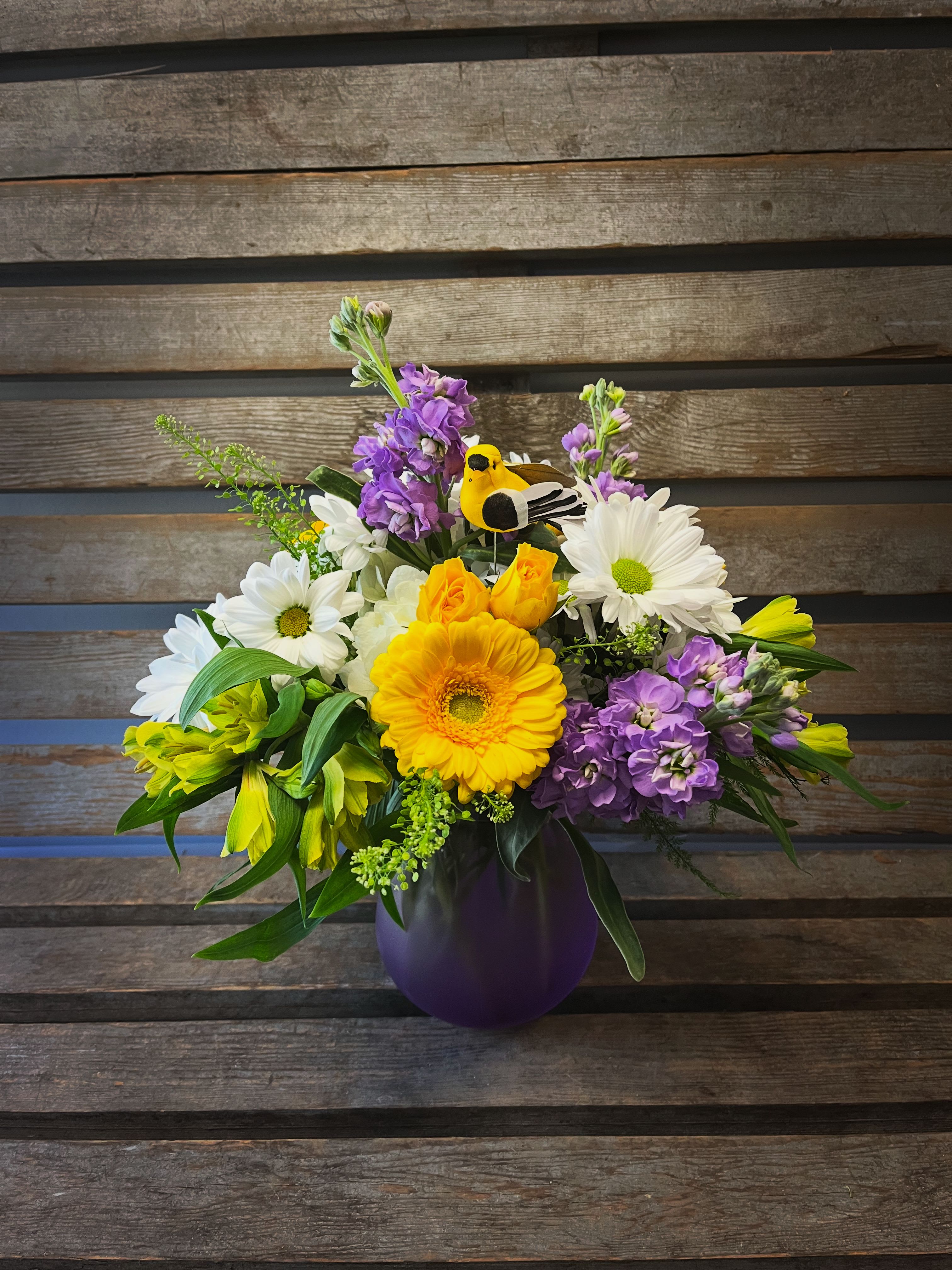 Daisies for Mom - Lavender Rachel vase for Mother’s Day filled with seasonal flowers in shades of lavender, white, and yellow.