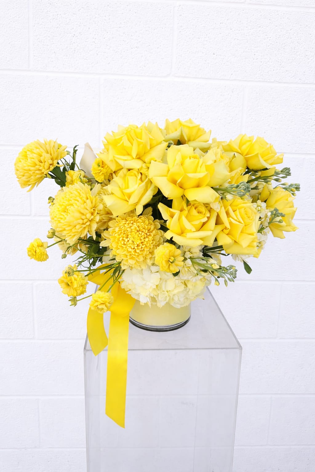 I Can't Believe It's Not Butter! - Can’t Believe It’s Not Butter! is a radiant study in soft sunshine. Layers of buttery yellow (the color of the season!) roses mingle with textured blooms and creamy whites, creating a bouquet that feels equal parts fresh, elevated, and impossibly happy. Designed to brighten a room (and a mood), this arrangement is the floral equivalent of golden hour—warm, glowing, and effortlessly chic.